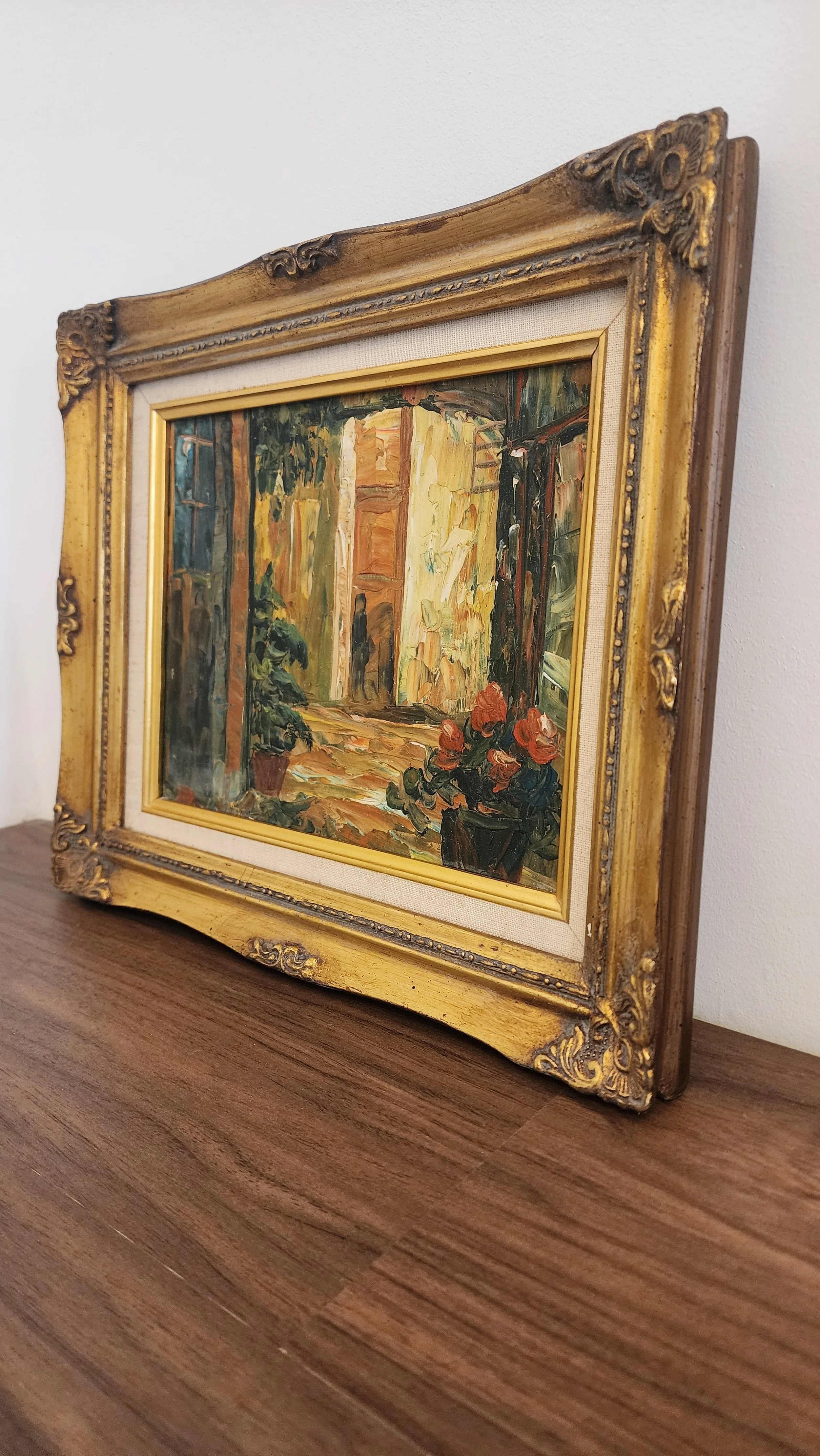 Side view of the framed painting showing frame detail and depth of canvas.