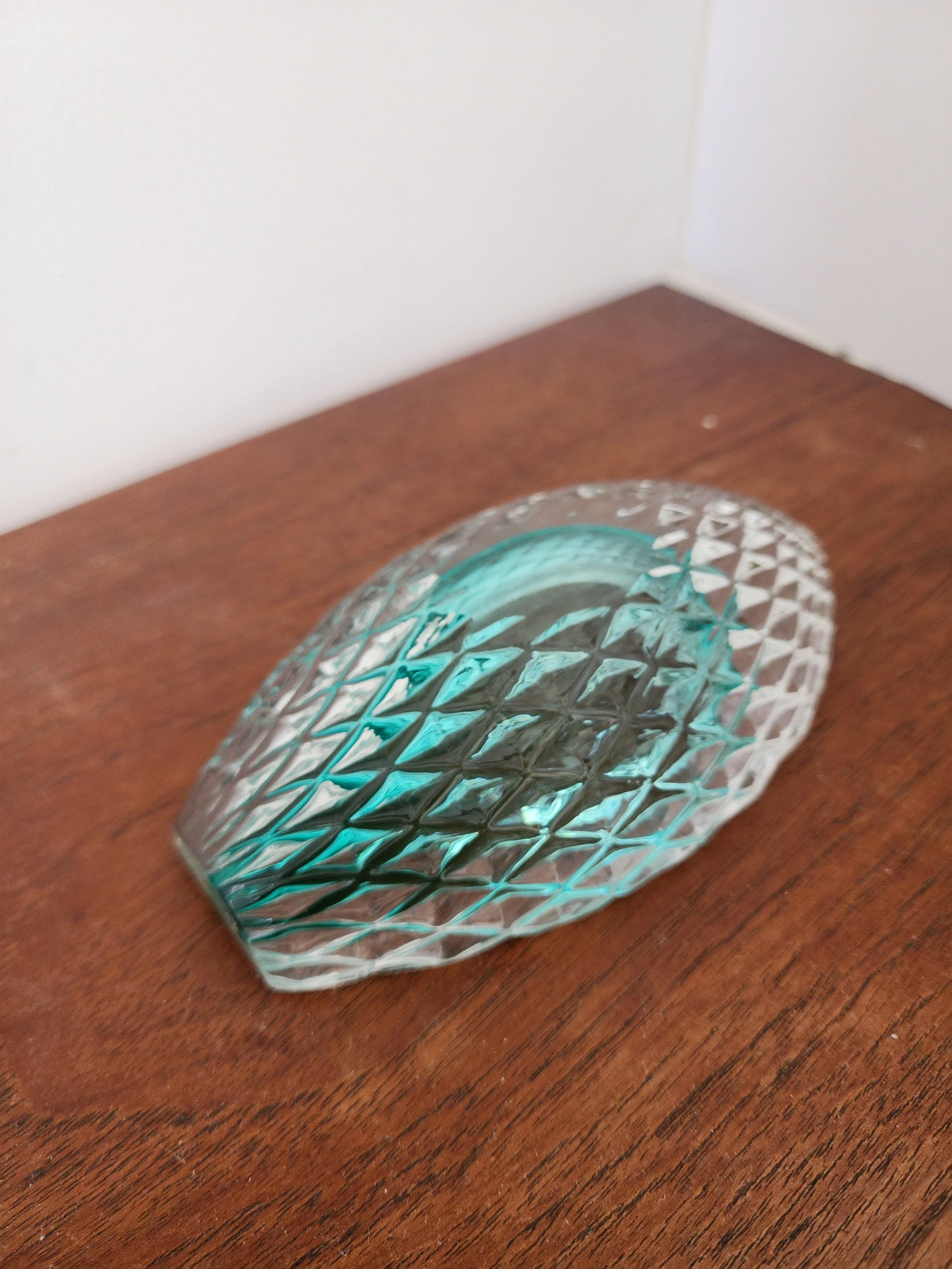 Retro glass centerpiece on neutral background.