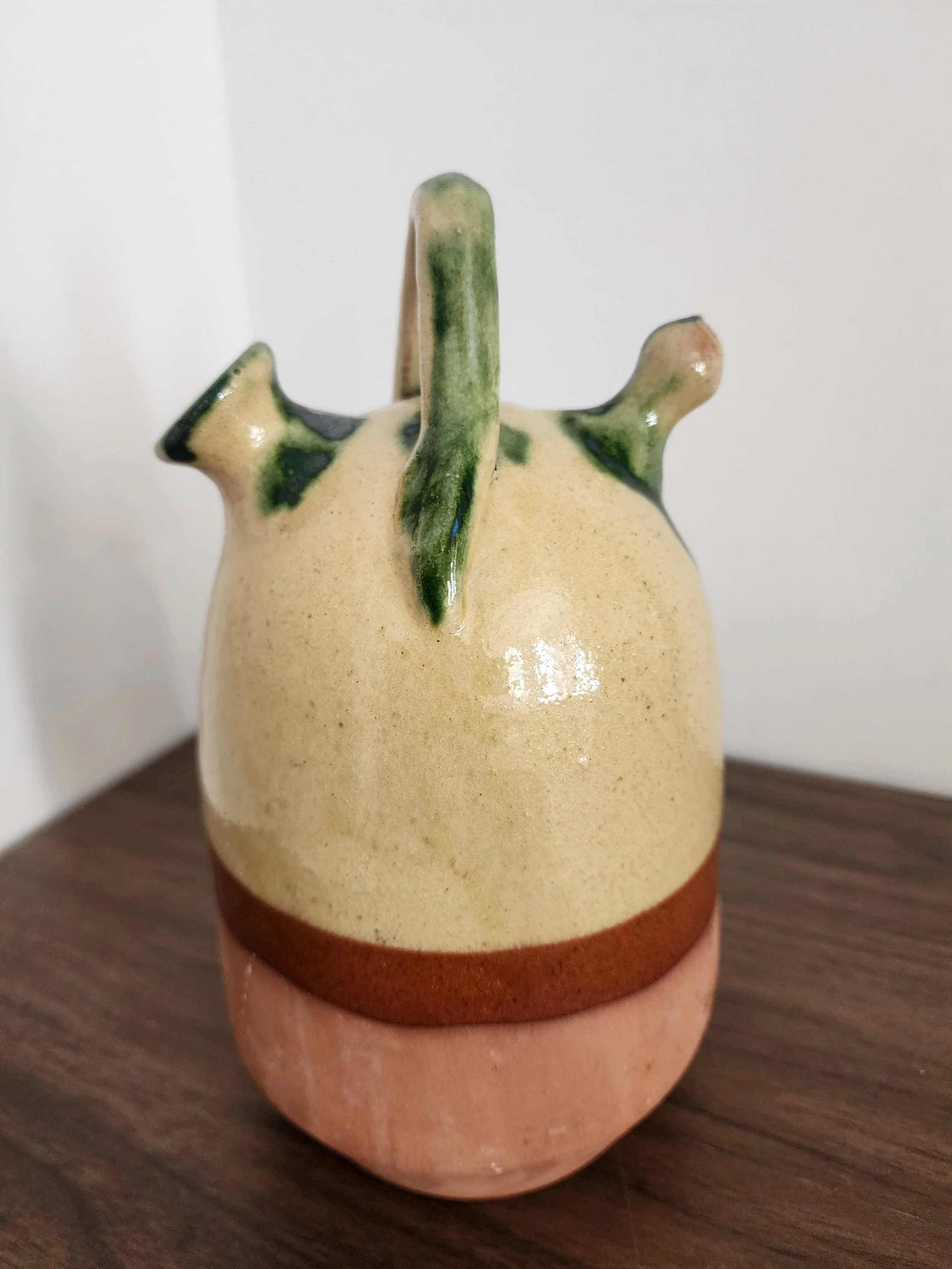 Detail shot showing terracotta base texture and color contrast.