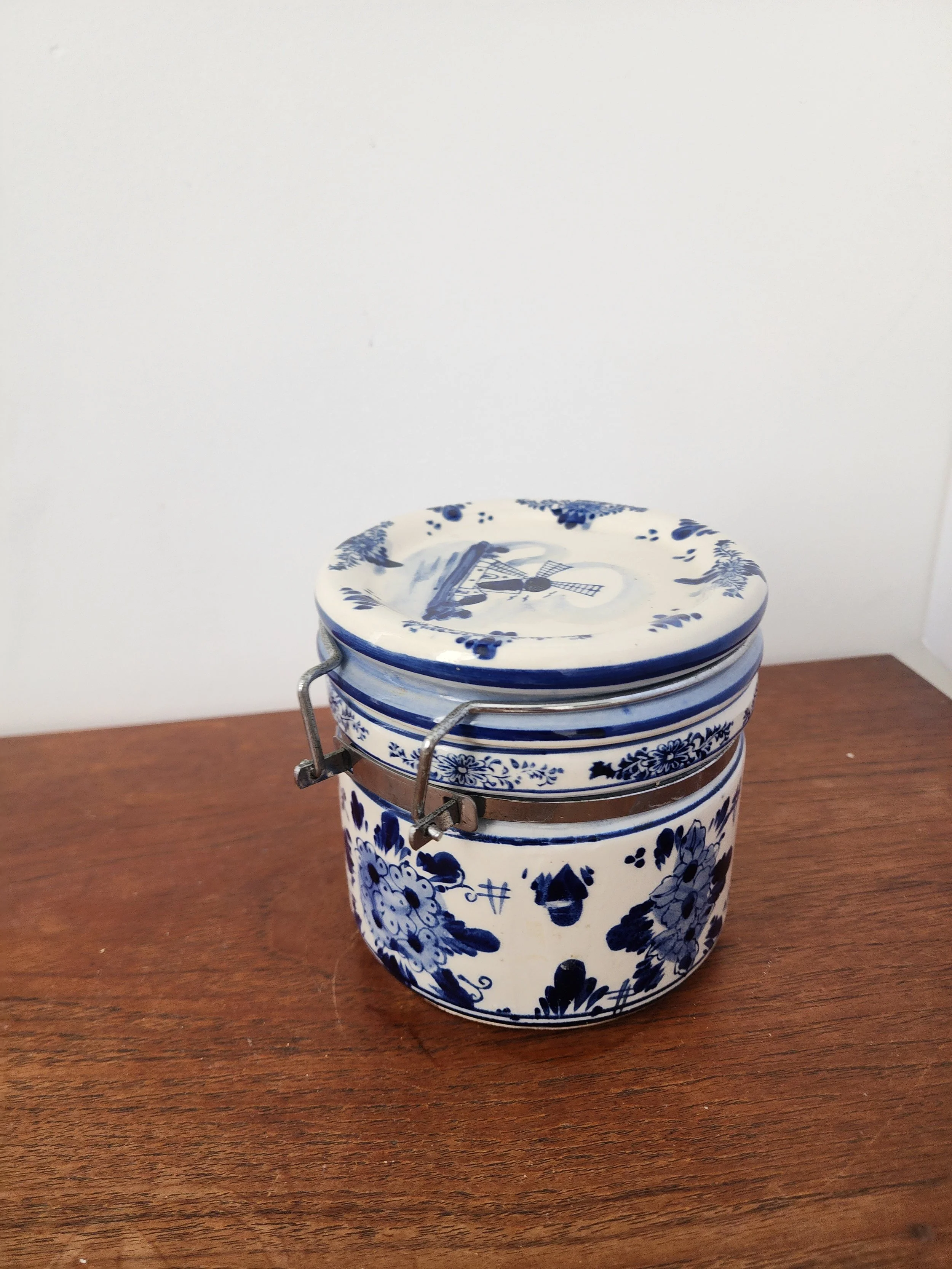 Close-up of Delft floral pattern and painted brushwork.