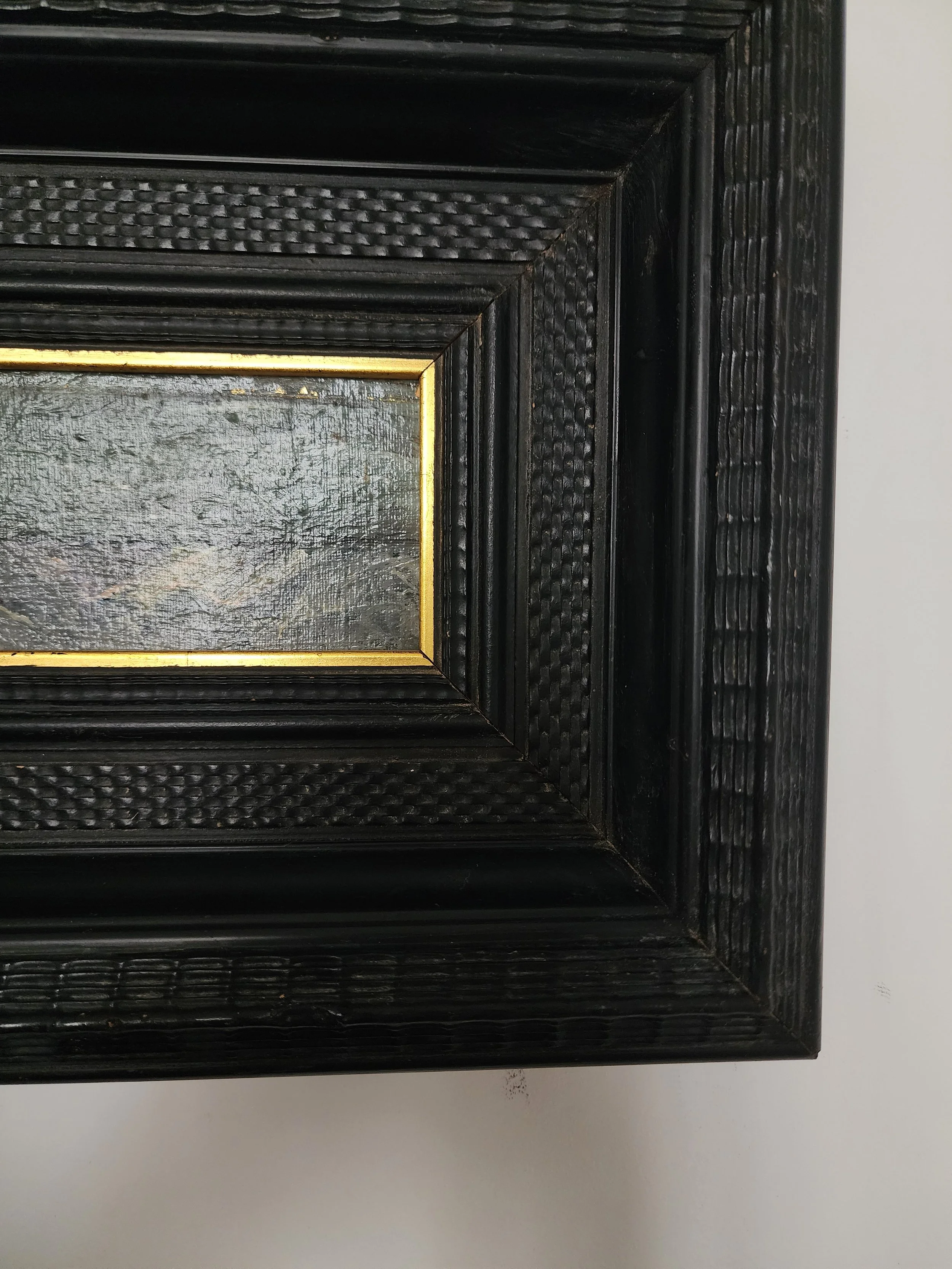 Vintage framed ocean scene on linen background.