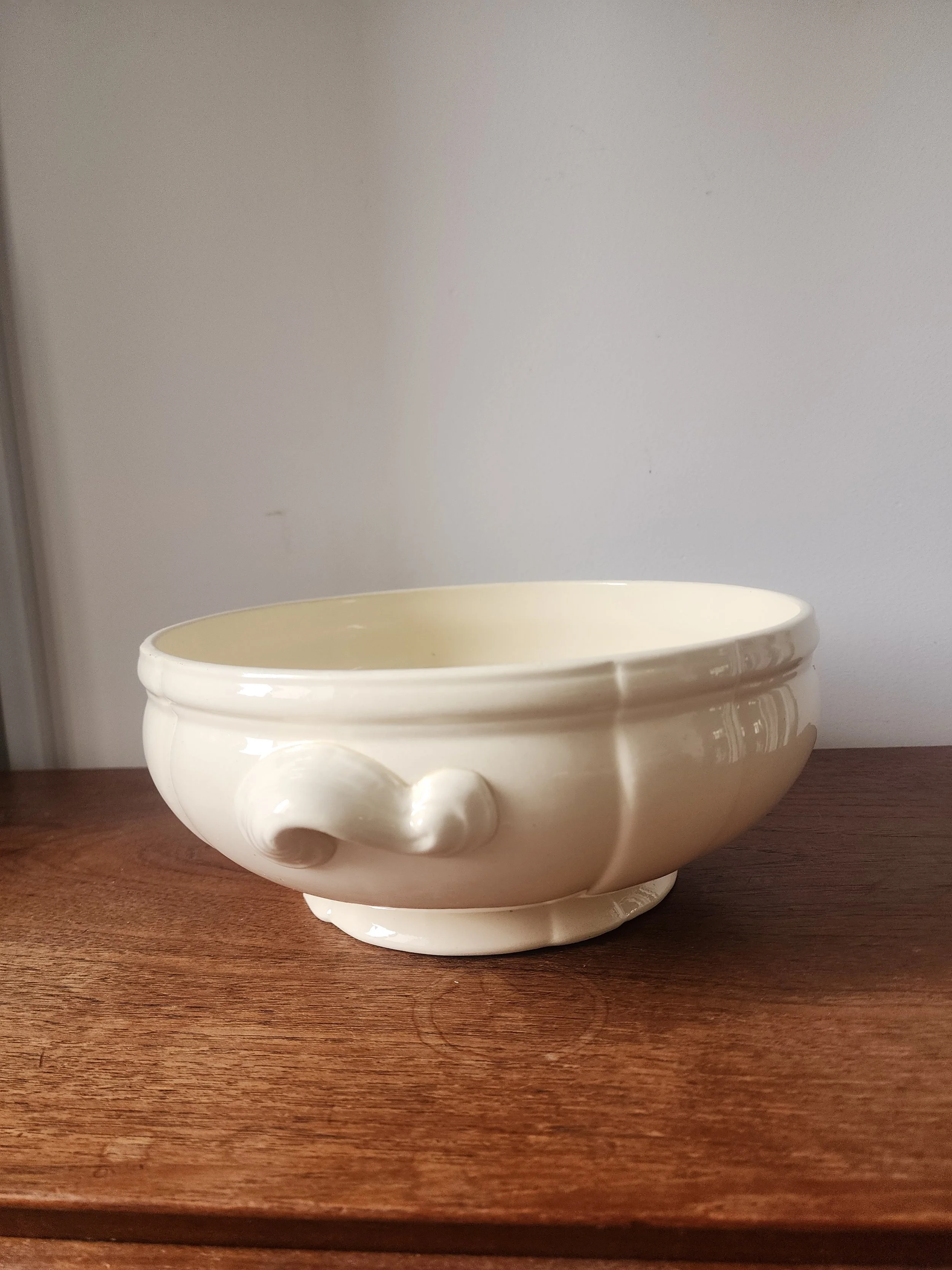 side view of white french ironstone bowl with handles