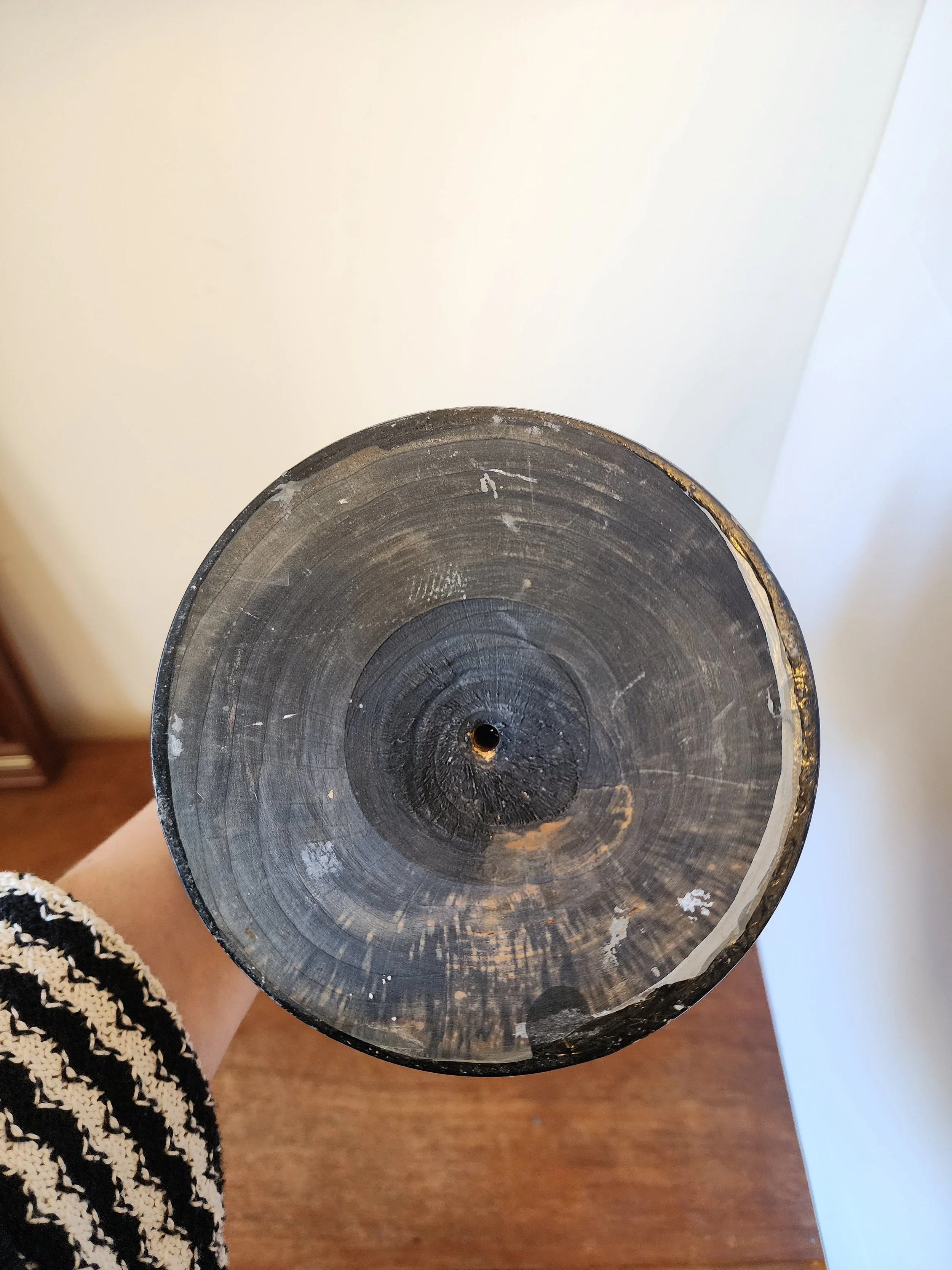 base detail of vintage trophy showing turned wooden pedestal