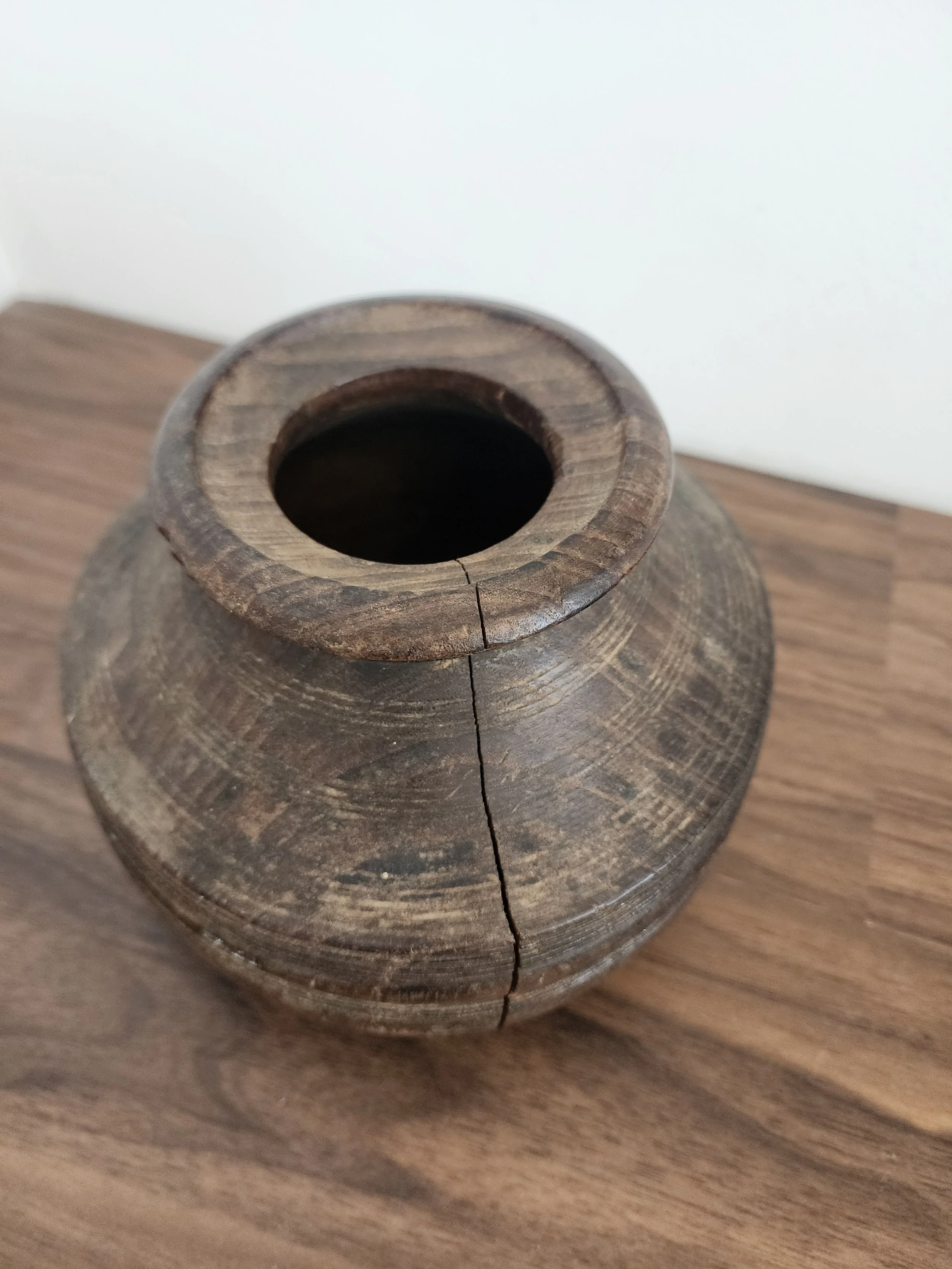 Close-up of wood grain texture and aged finish.