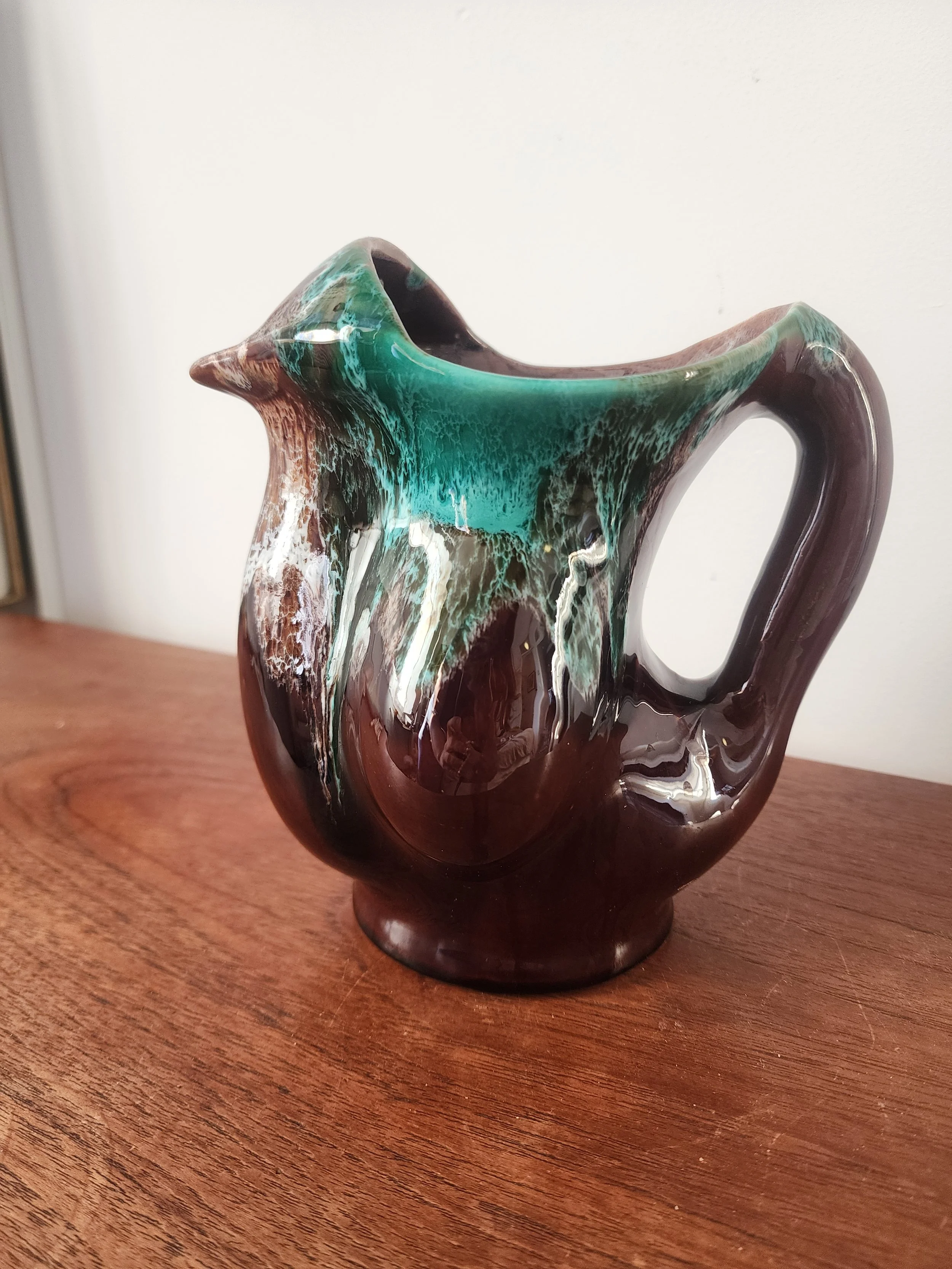 close up of drip glaze texture on vintage pottery