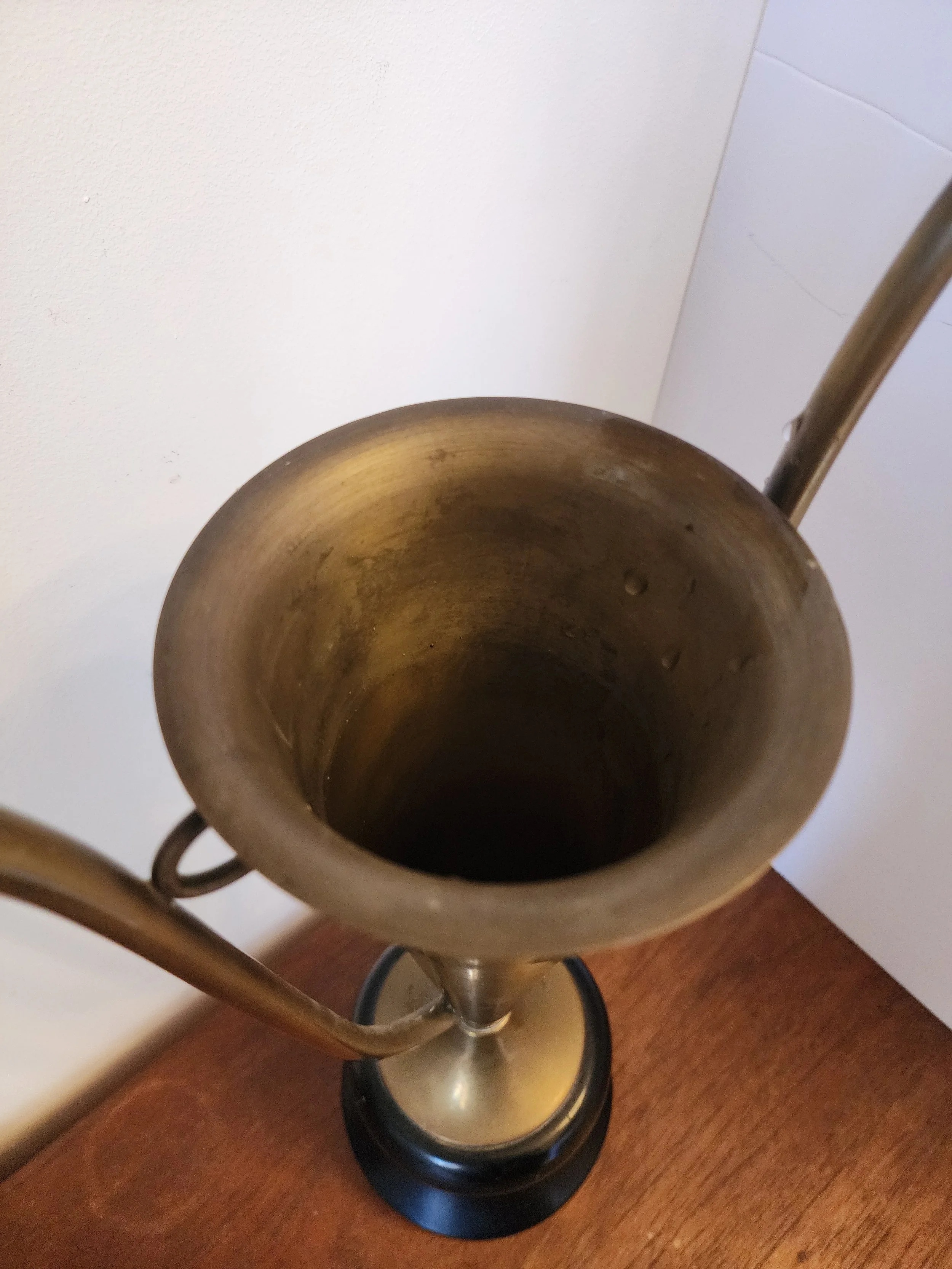 close up of patinated brass trophy surface and engraved details