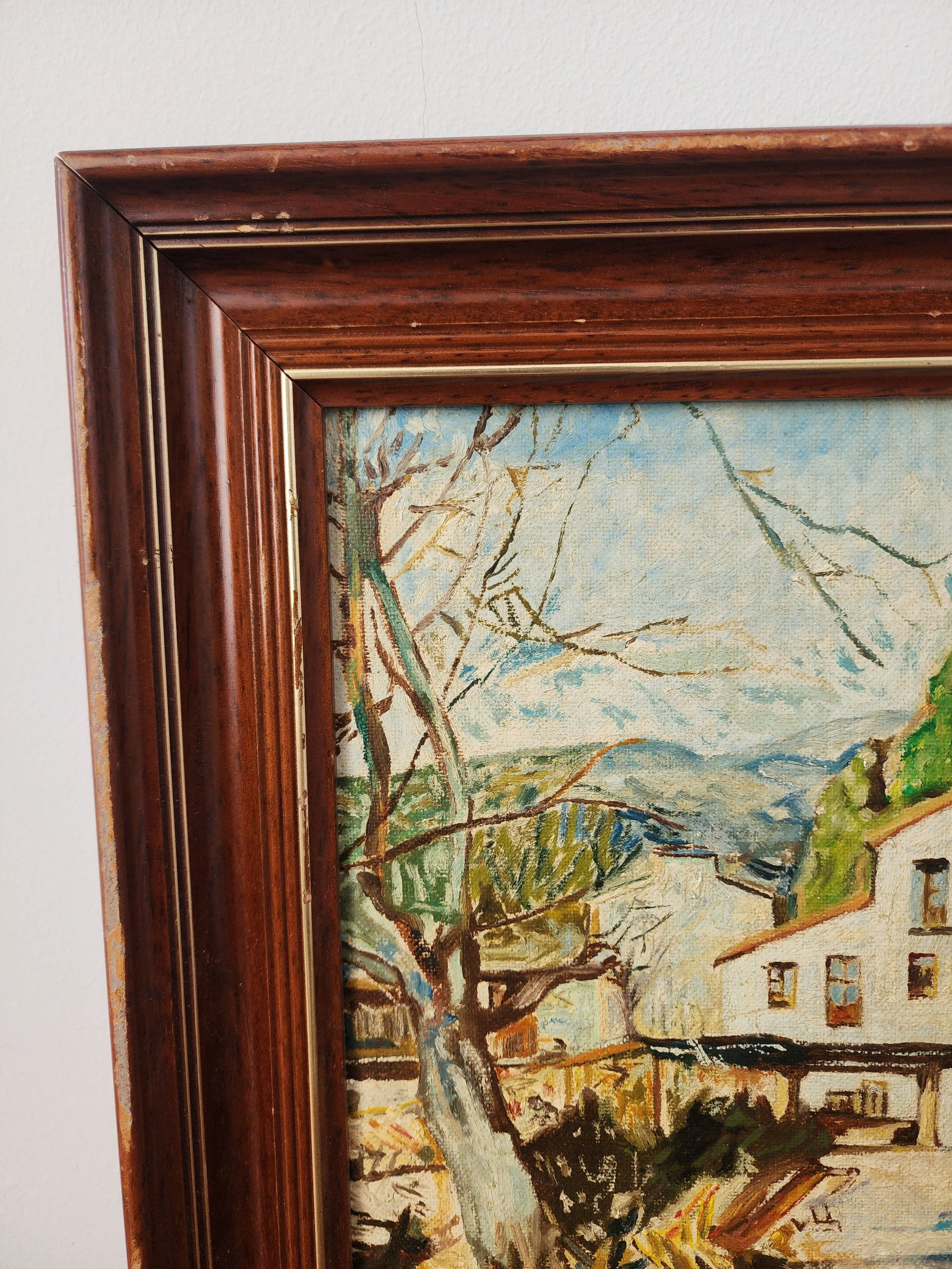 Close-up of textured oil brushstrokes and rustic frame detail.