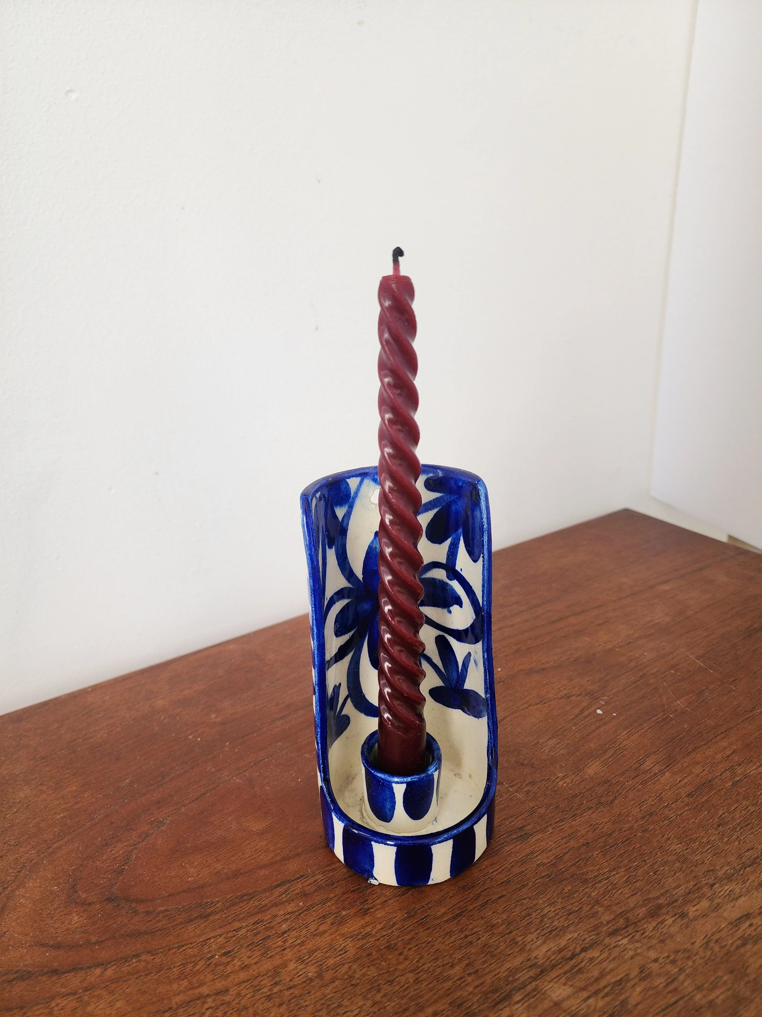 Vintage Spanish blue and white ceramic candlestick with floral design.