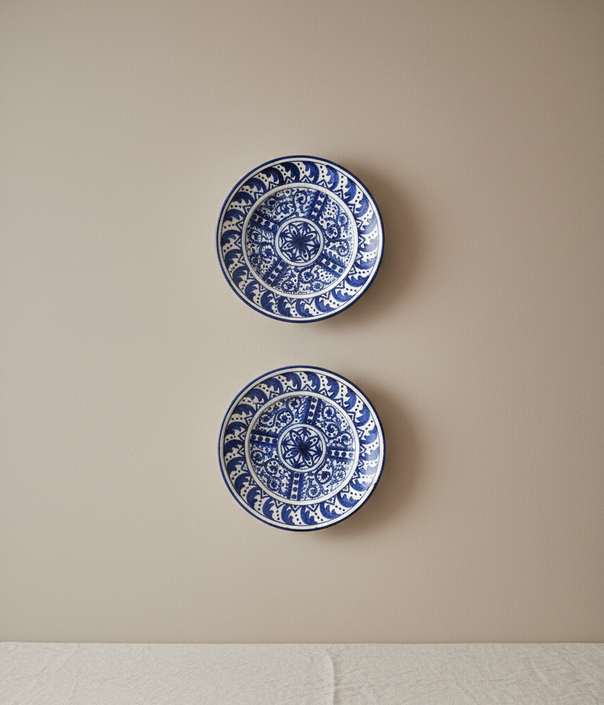 Vintage ceramic plate set styled for modern home decor.