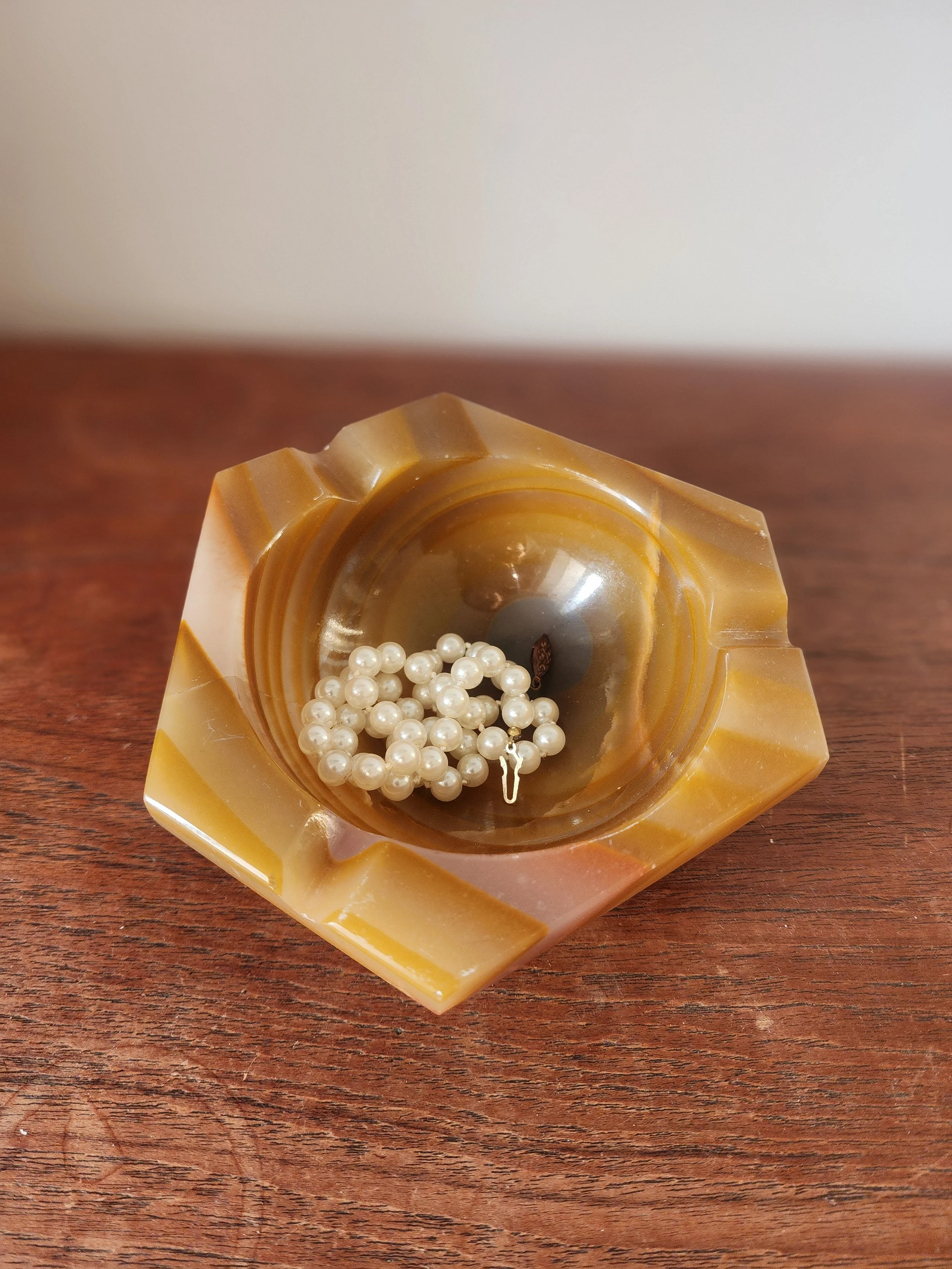 side view of vintage honey onyx bowl