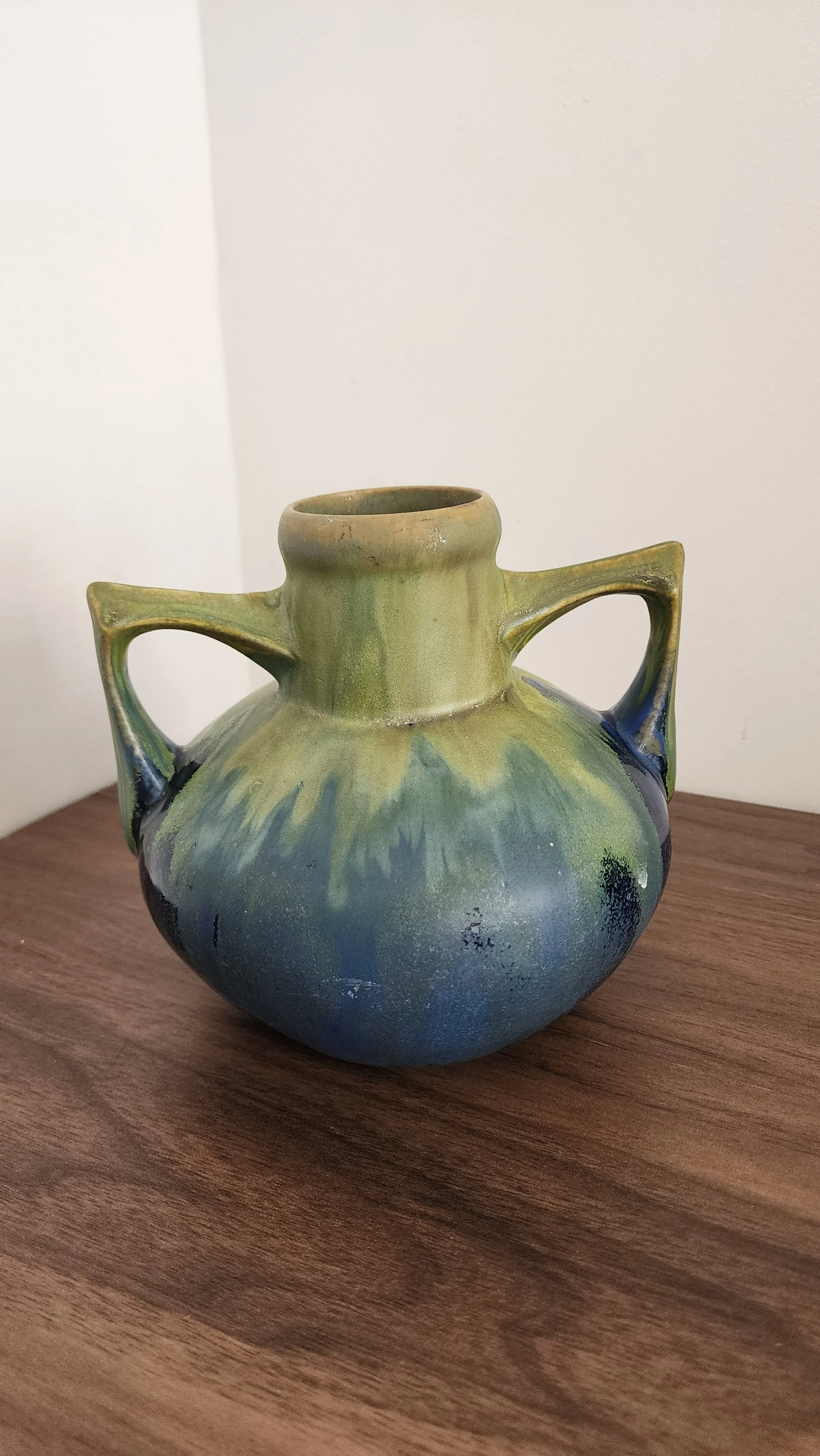 Side angle of Méténier vase showing twin handles and sculptural form.