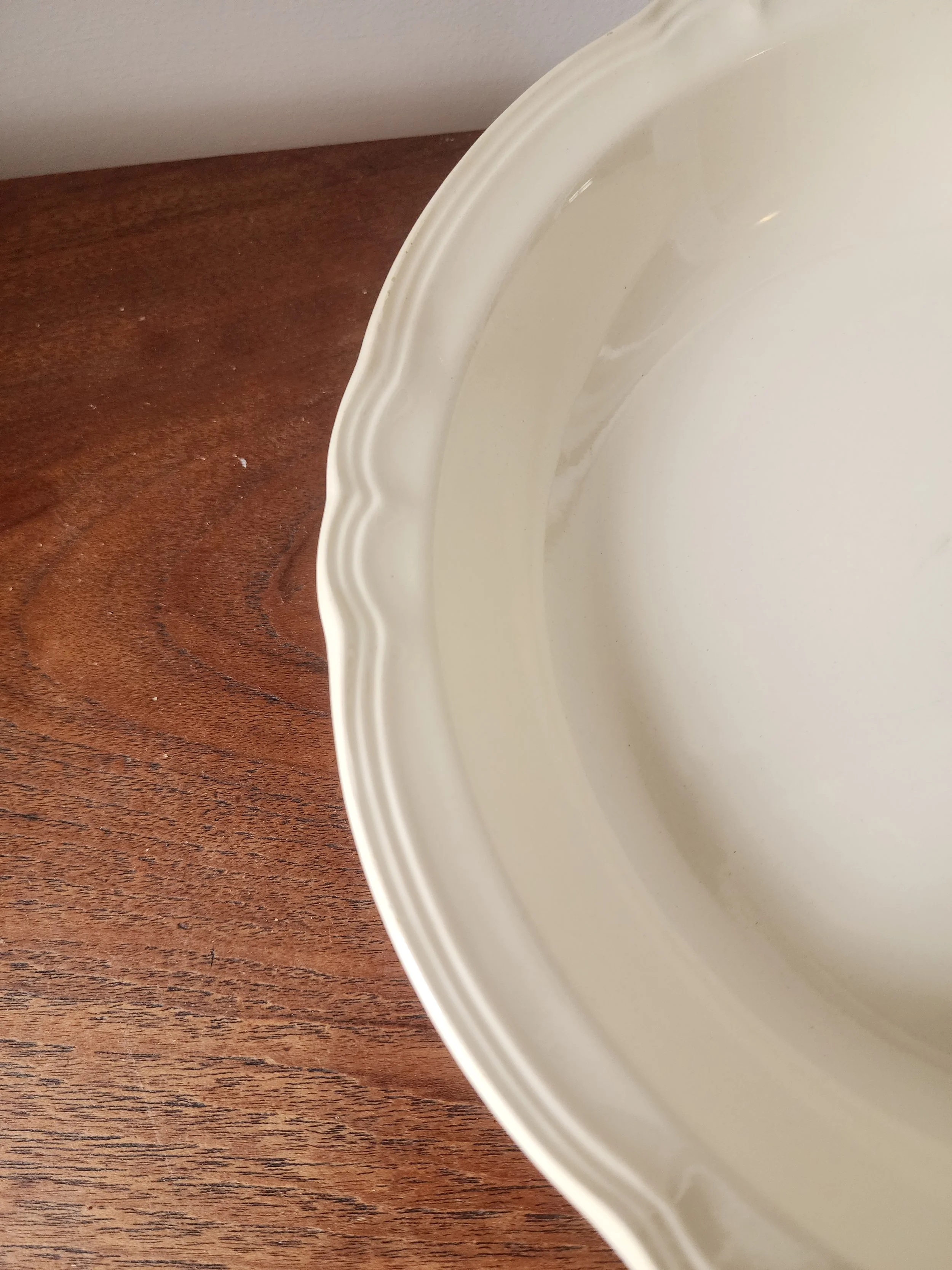 side view of shallow white ironstone serving dish