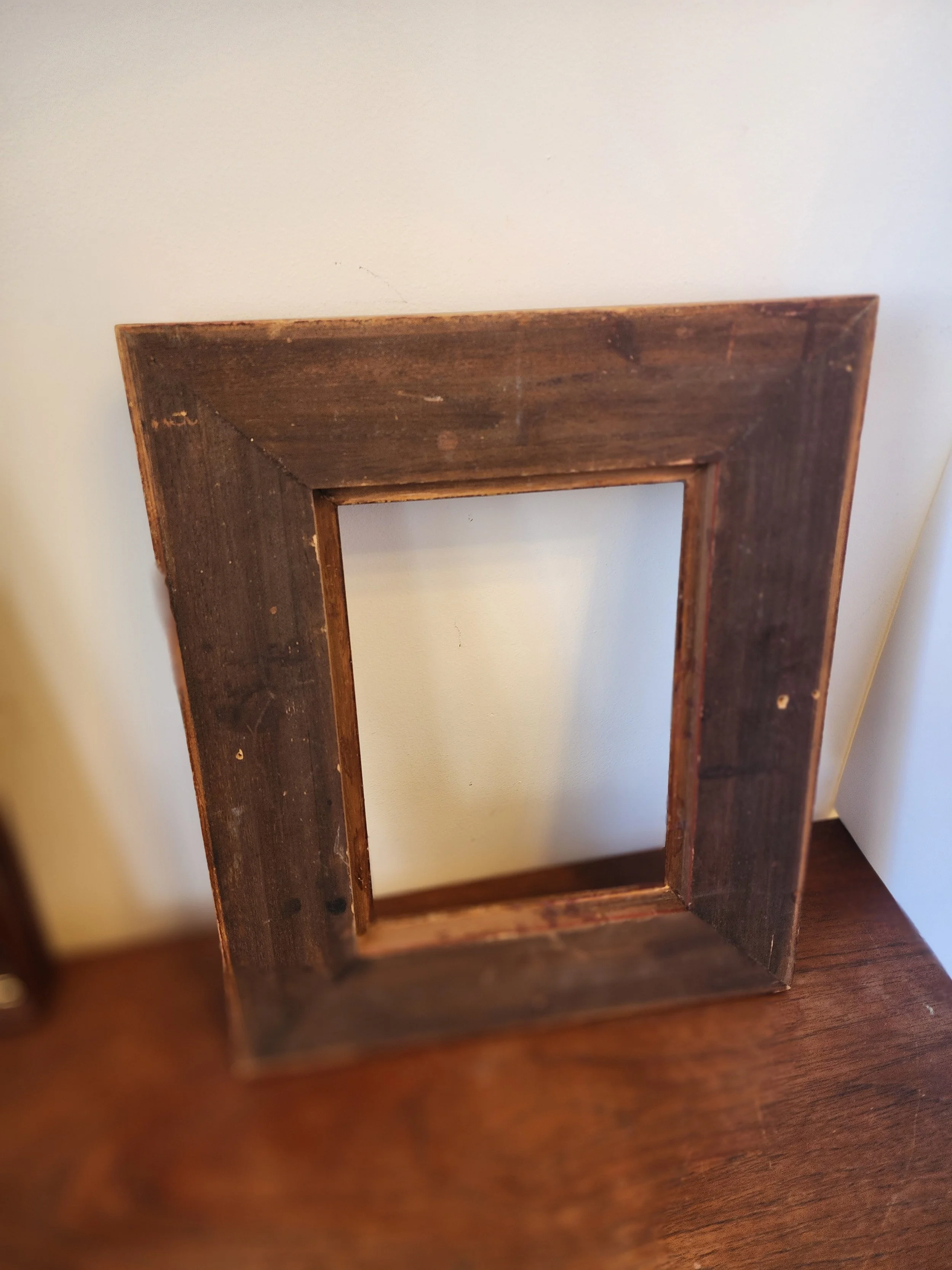 back view of vintage gold wooden picture frame ready to hang