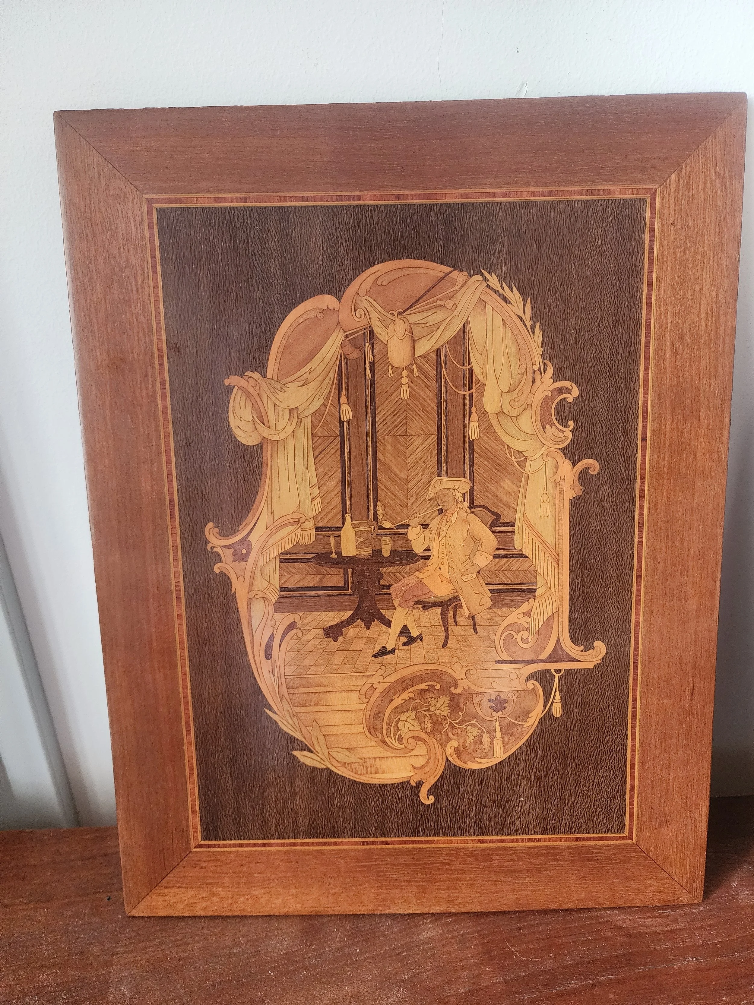 styled interior featuring pair of antique style marquetry panels