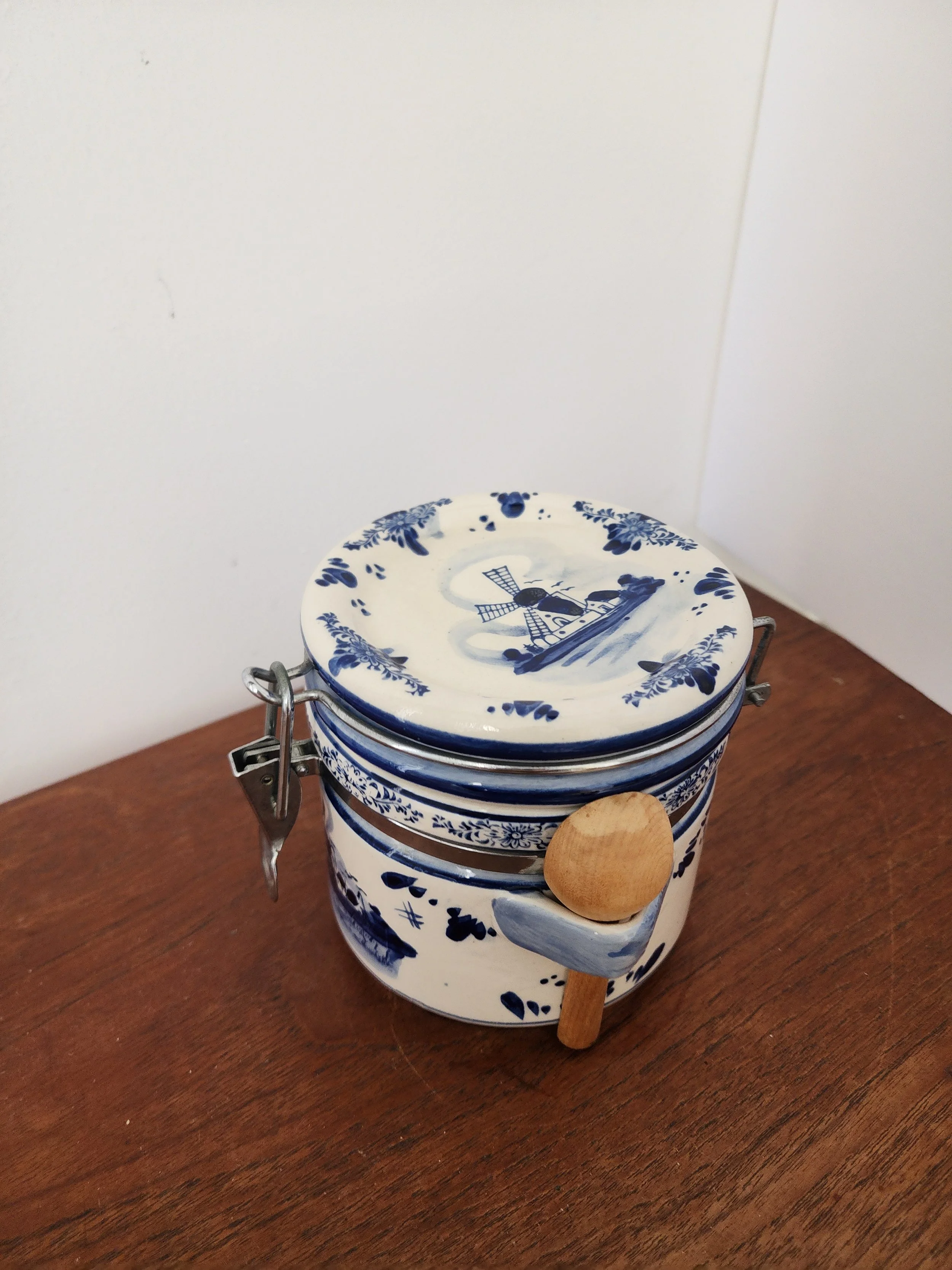 Side angle showing cobalt blue Delft design and ceramic lid.