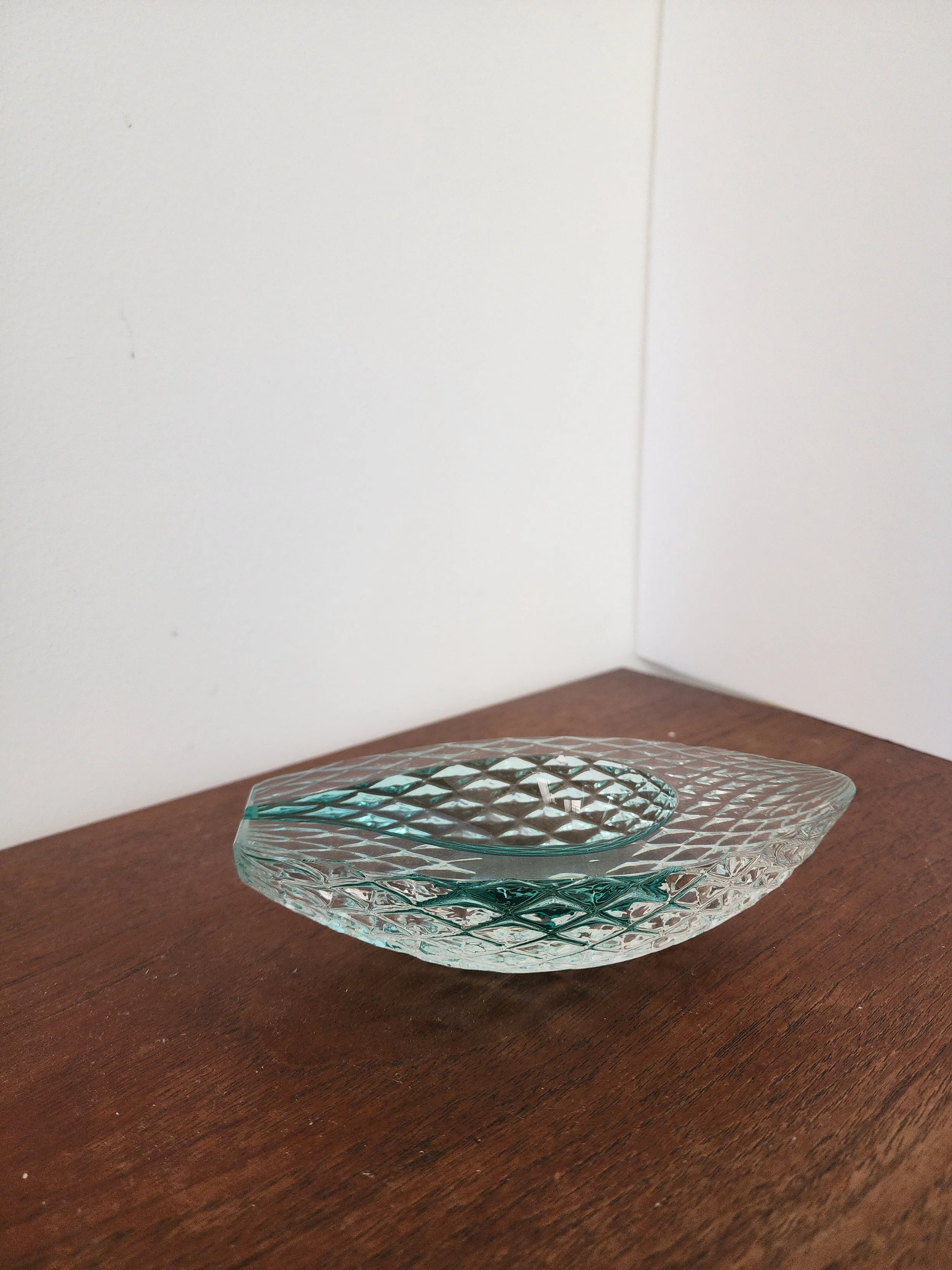 Mid-century modern glass catchall with diamond texture.