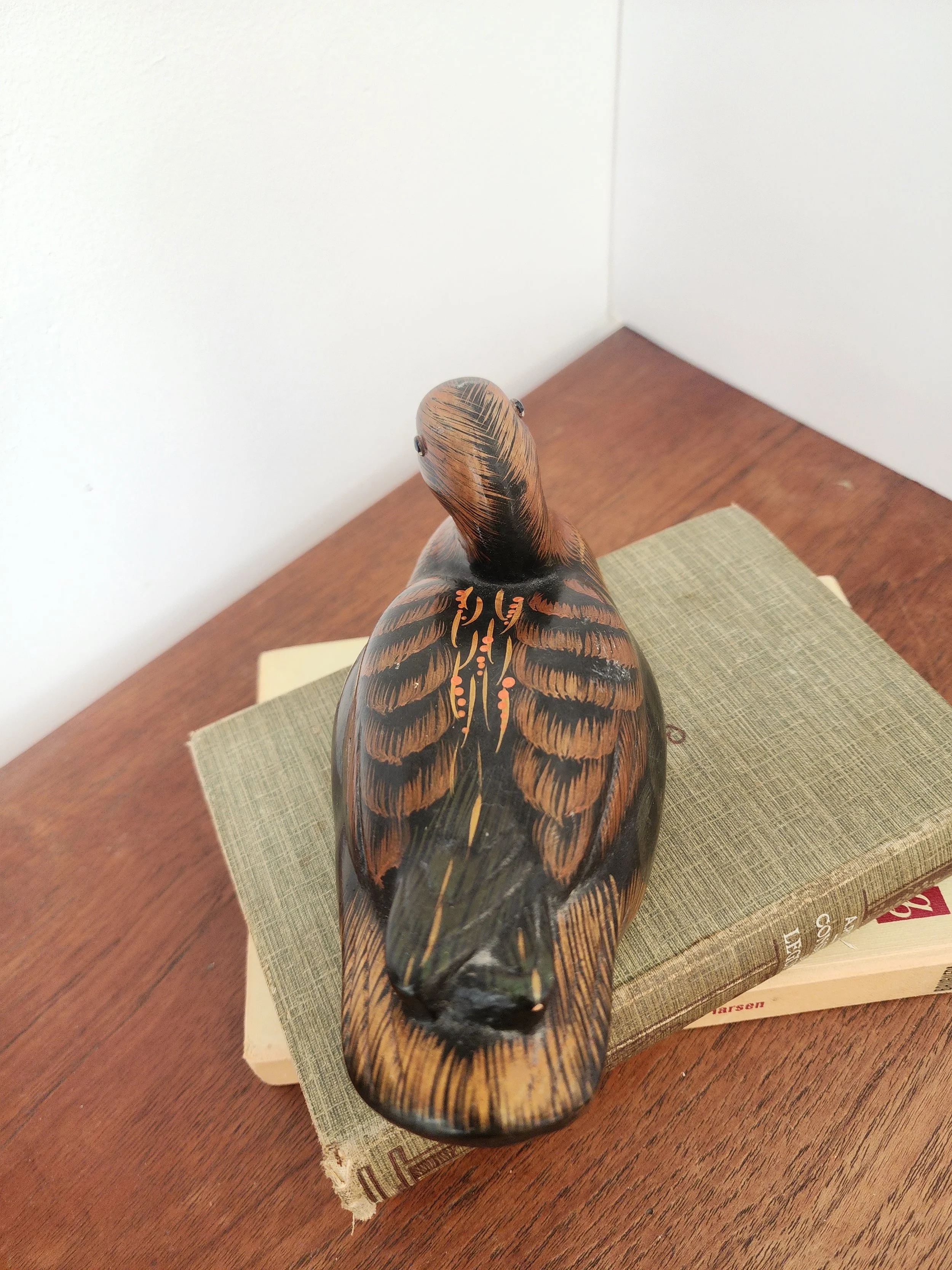 “Cottage-style ceramic duck figurine featuring painted feather details.”