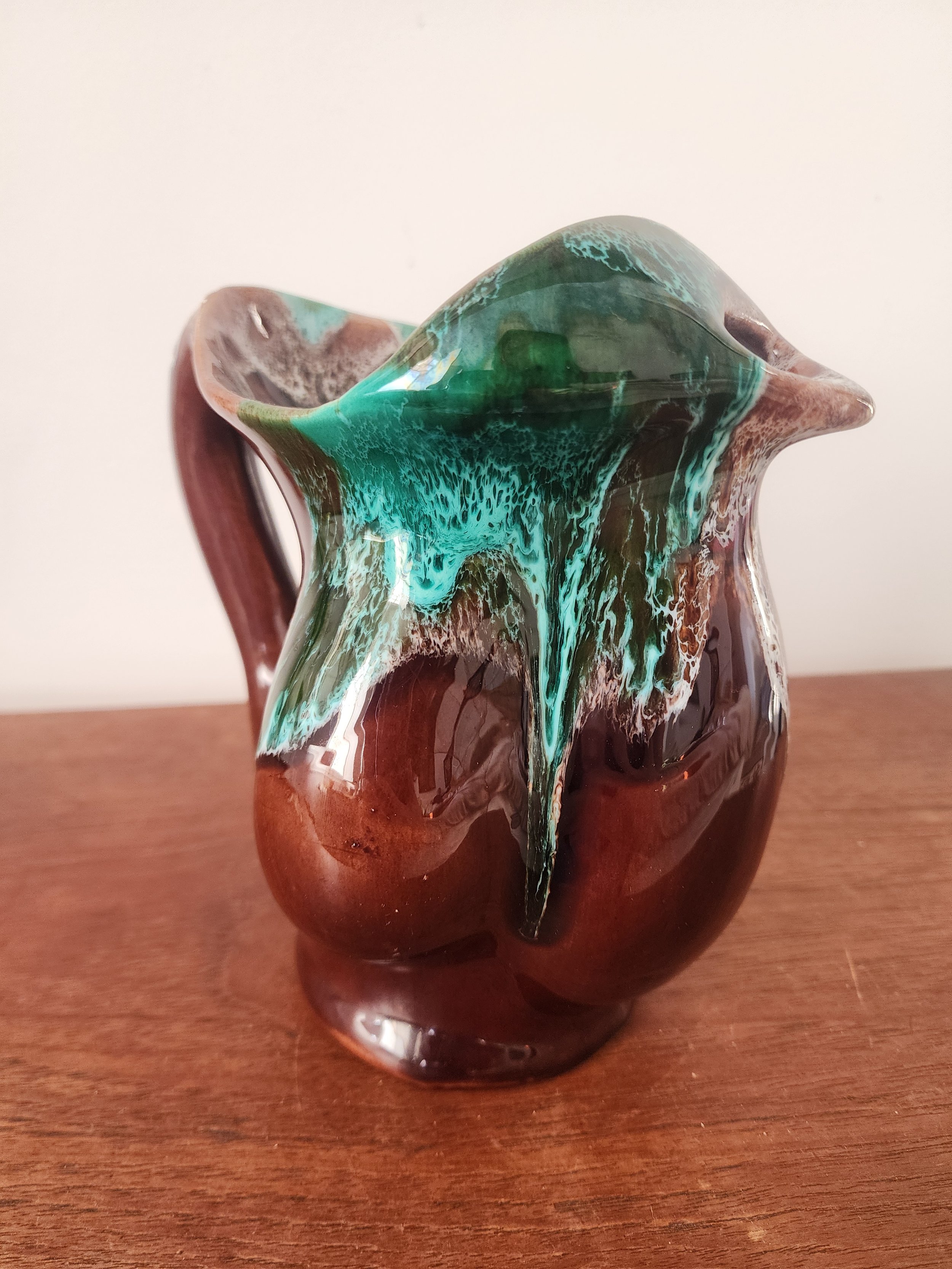 rustic ceramic pitcher styled as decorative vase