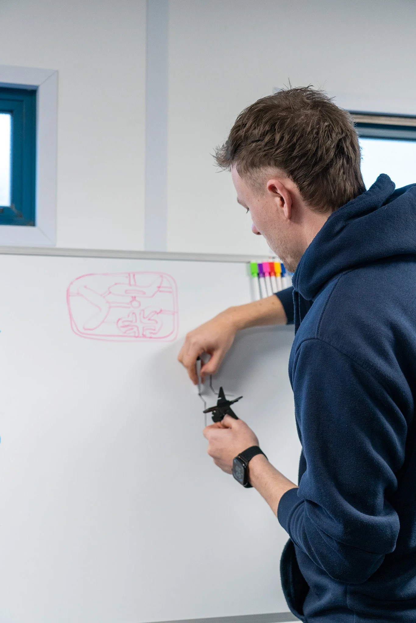 jcm-testing-engineer-drawing-on-whiteboard