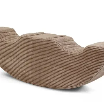 A brown, curved, ribbed lounge chair with a modern design