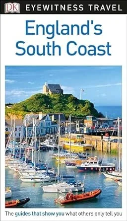 A promotional cover for a travel guide titled 'England's South Coast' showing a harbor with sailboats, a green hill with a building on top, and a blue sky.