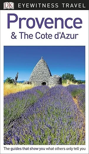 Travel guidebook cover titled 'Provence & The Cote d'Azur' featuring a landscape with a stone castle surrounded by lavender fields under a clear blue sky.