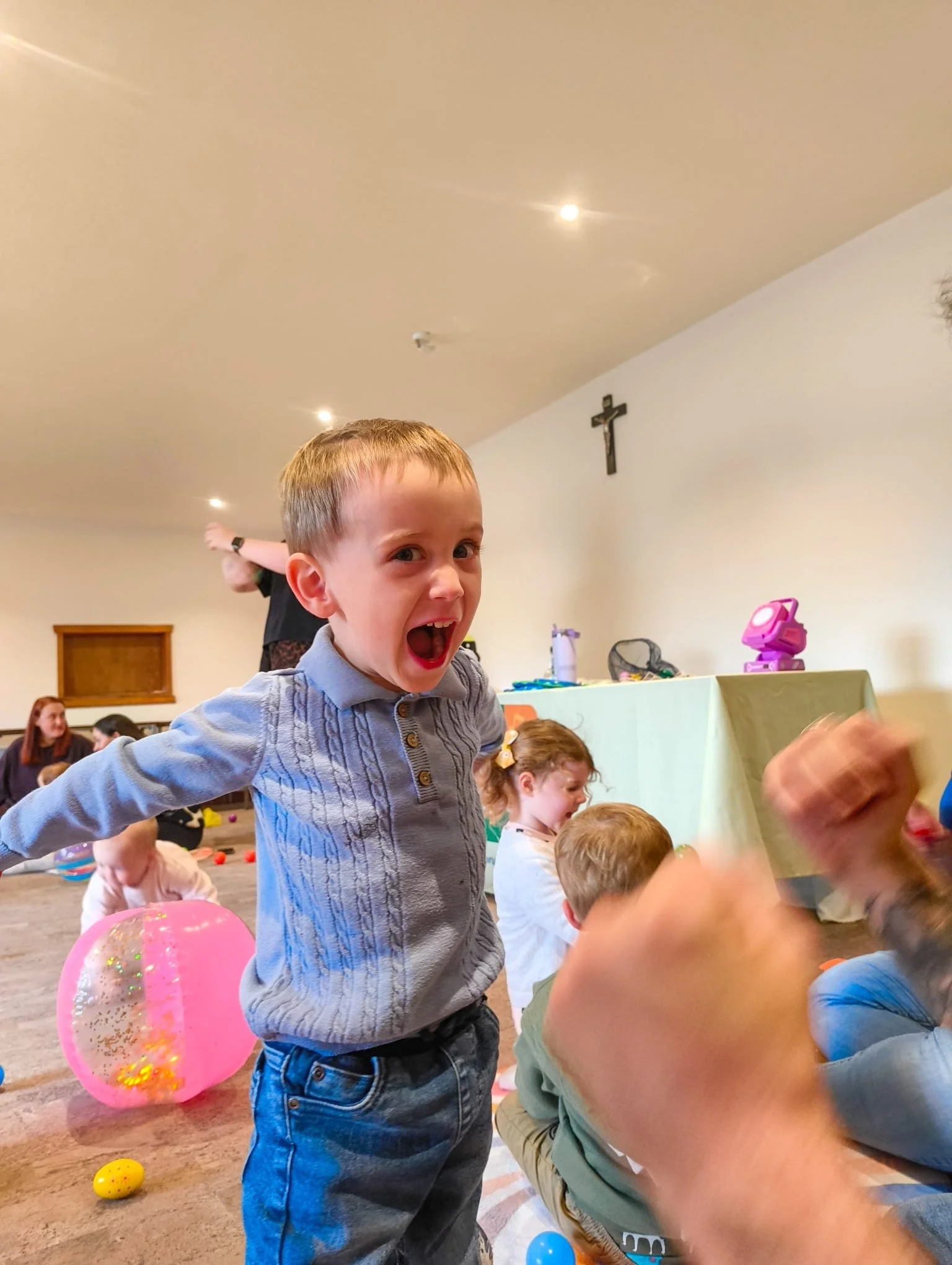 toddler boy jumping and laughing