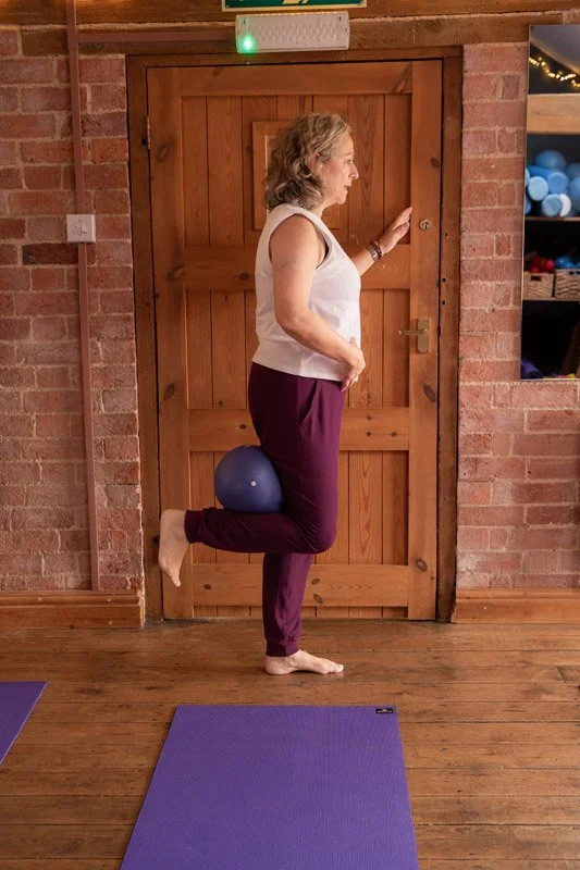 Paula Edmonds with ball during Pilates session