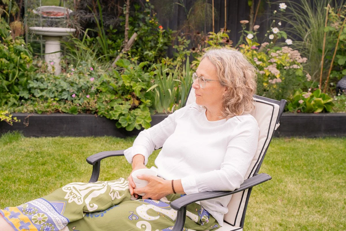 Paula Edmonds sitting in garden - Health and fitness coaching
