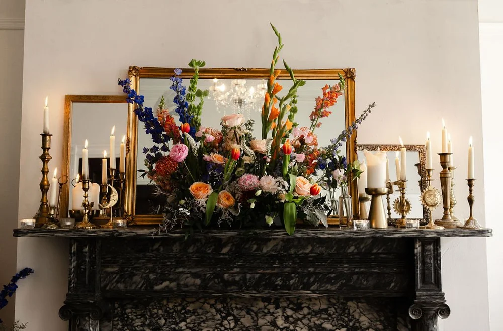 Floral and candle installation on the historic Vaux Studio fireplace