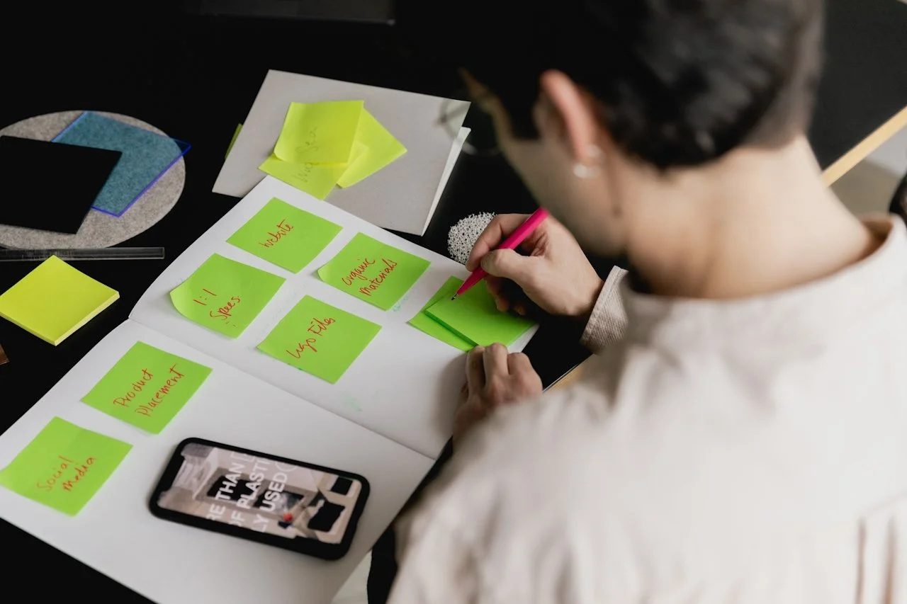 Person planning weekly social media posts