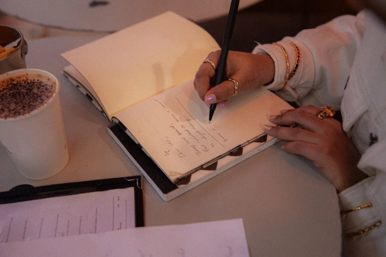 Woman brand planning in notebook