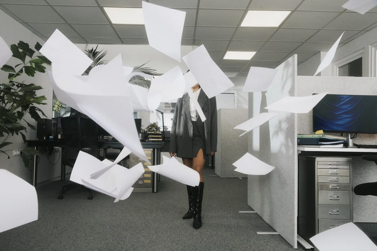 Small business owner reviewing brand materials in office