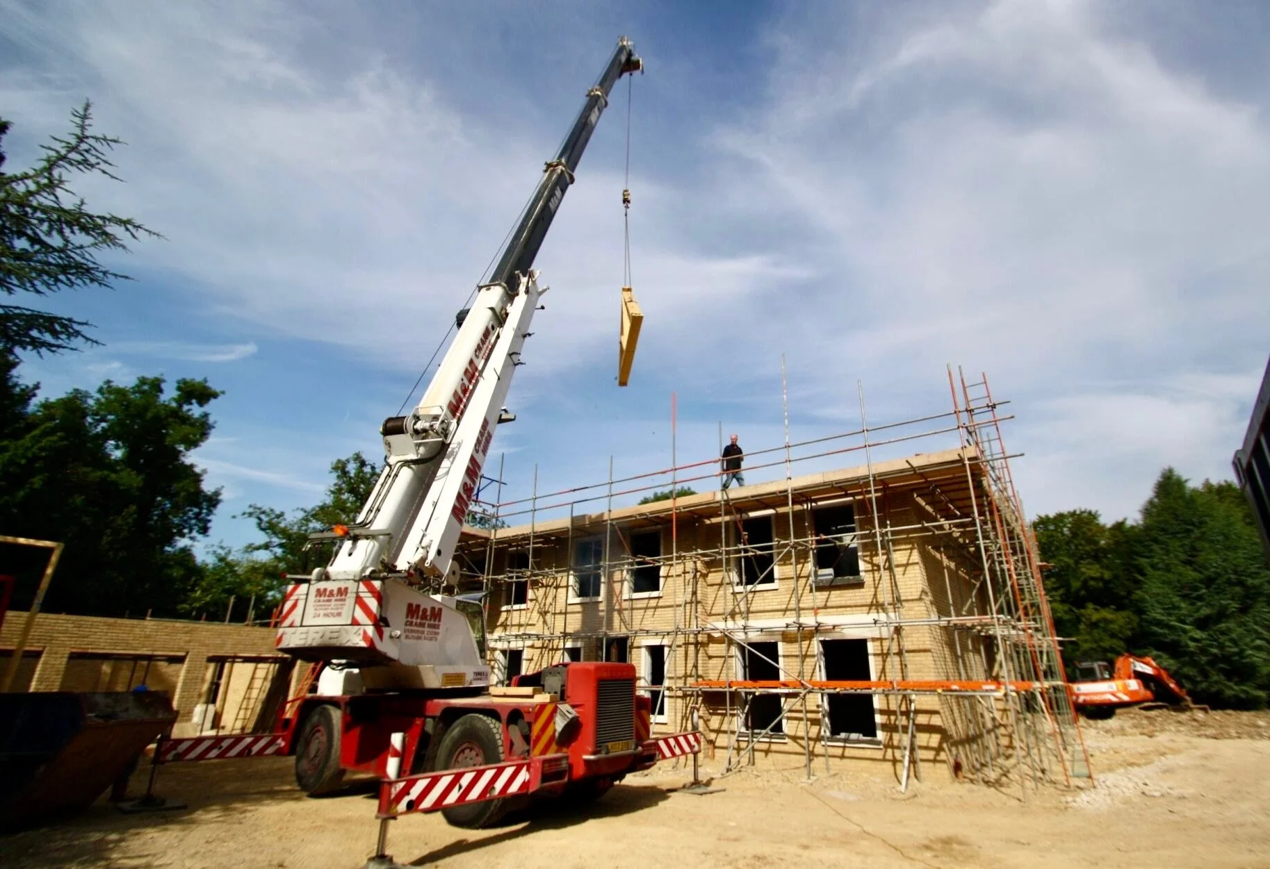 Contruction of complete buildings solutions new build for best builder in surrey guide