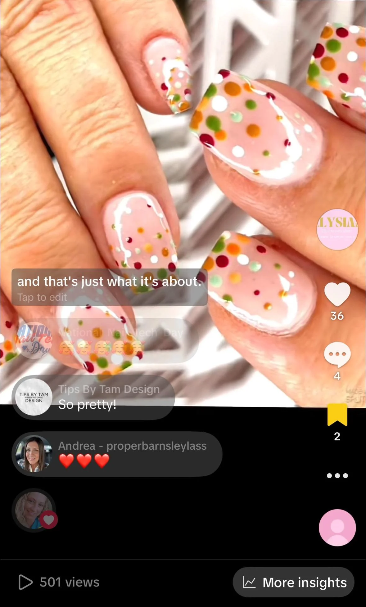 Close-up of decorated nails with colorful polka dots in red, green, white, yellow, and orange on a light pink base.
