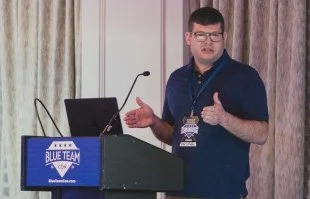 chris roffe speaking at a podium
