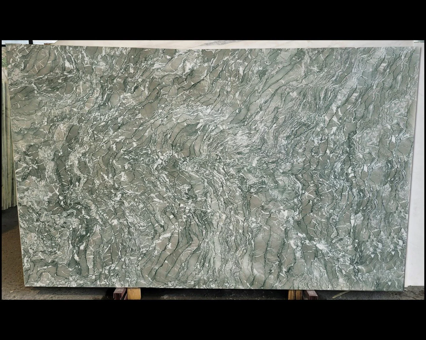 Verde Antigua | Where Nature Paints in Green 
An Italian marvel, Verde Antigua captivates with a soft, mossy green base elegantly veined with whispers of cream, stormy grey, and deep emerald. 
2nd slide shows this bookmatched.