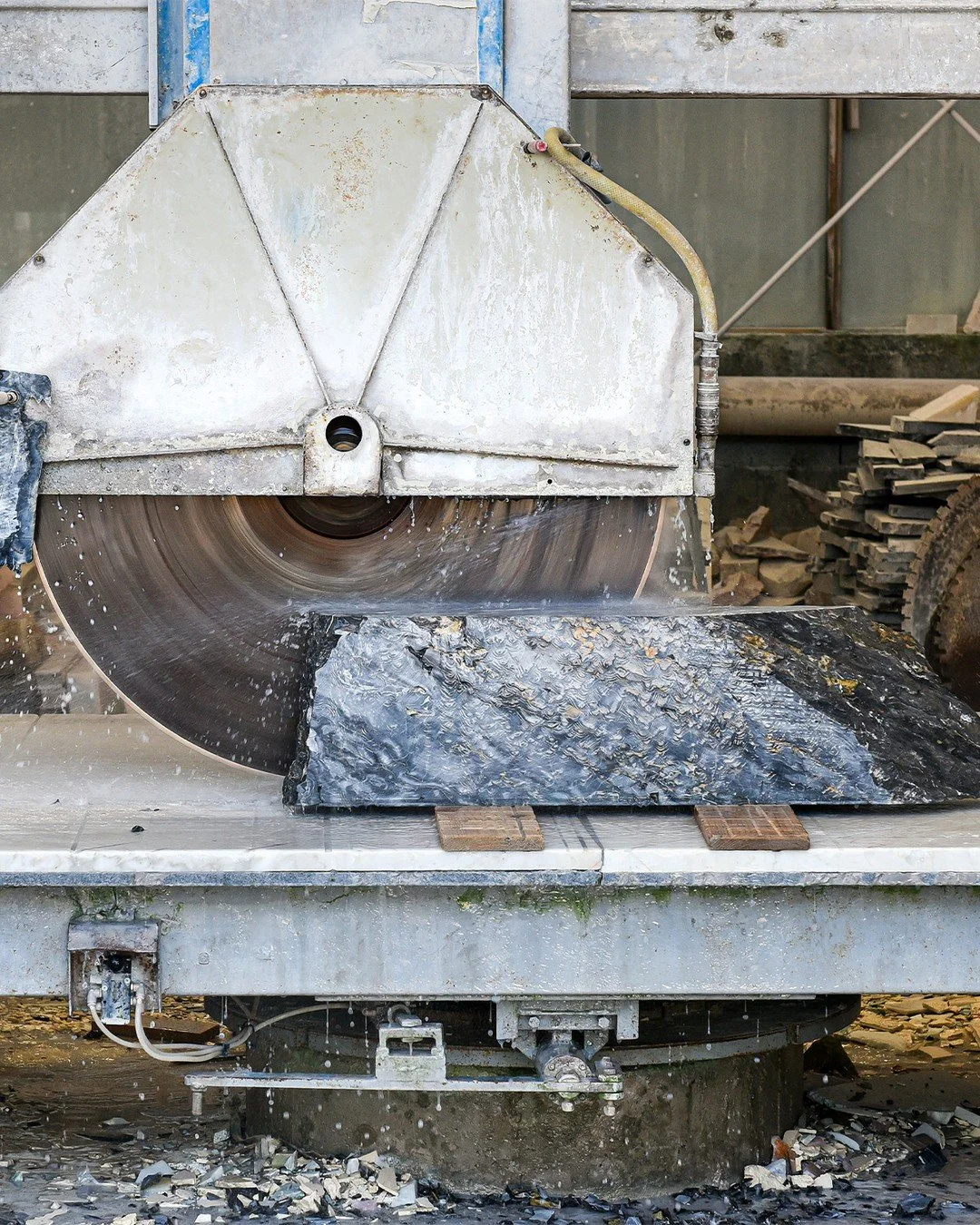⚙️ Precision in Progress
It takes some of the largest, most powerful tools to shape the finest natural materials. 
Here, a massive circular saw slices through a raw block of marble—one of the first steps in creating luxury furnishings and archi