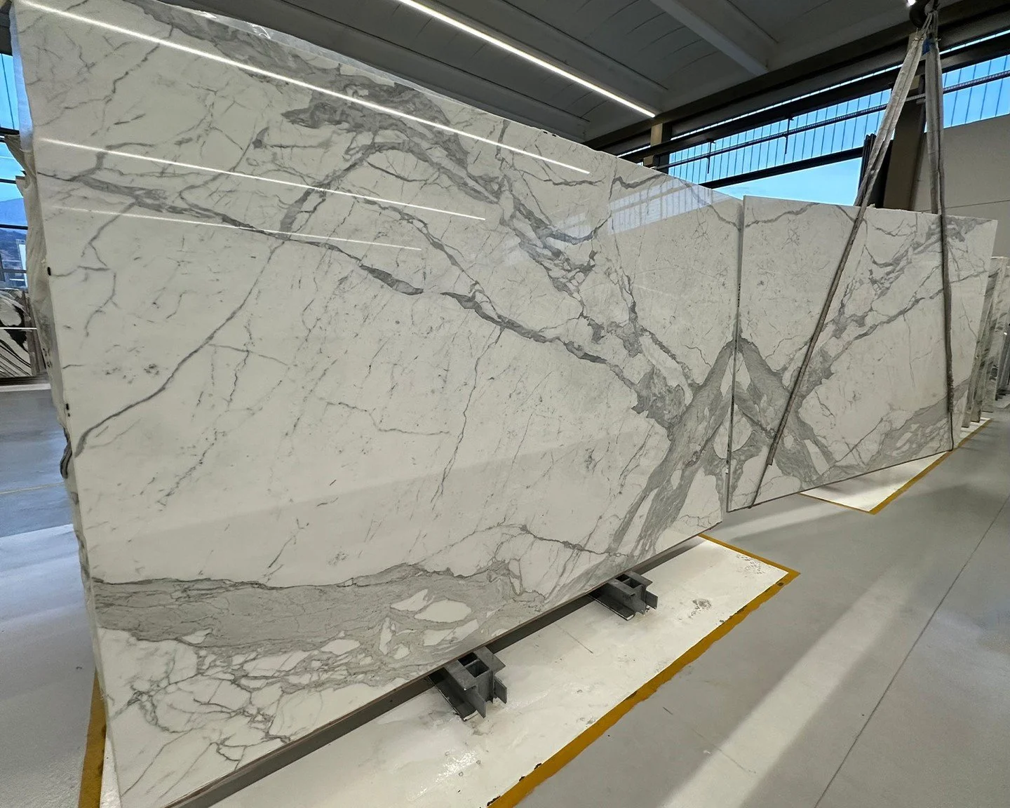 A stunning bookmatch test in the warehouse—two massive slabs of exquisite marble aligned to reveal perfect symmetry. The veining flows in harmony, creating a bold, sculptural statement destined to transform its setting into a work of art.
#unic