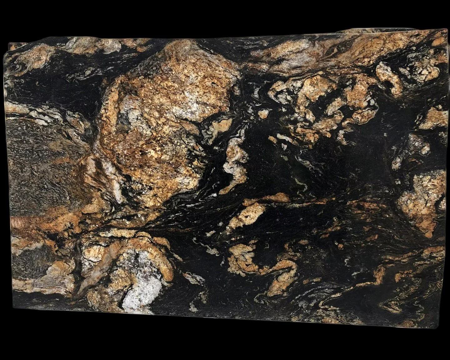 A dark allure for the Halloween holiday today. Fusion Black Granite captivates with swirling ribbons of gold, silver, and jet black—an elemental drama captured in stone. Both bold and refined, its natural movement and metallic warmth bring dept