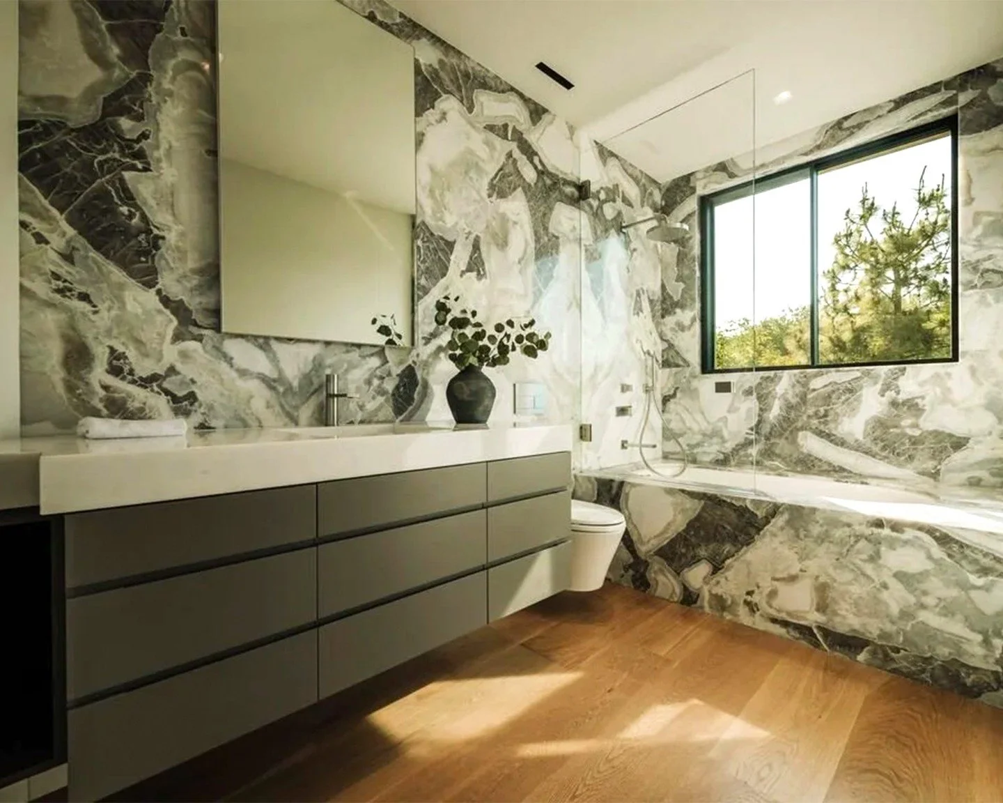 Statement Stone in Bel Air
Large-cut marble slabs create a striking, seamless flow throughout this custom bathroom&mdash;each piece uniquely patterned, ensuring no two walls are ever alike. The result is sleek, sculptural, and undeniably bespoke&mdas