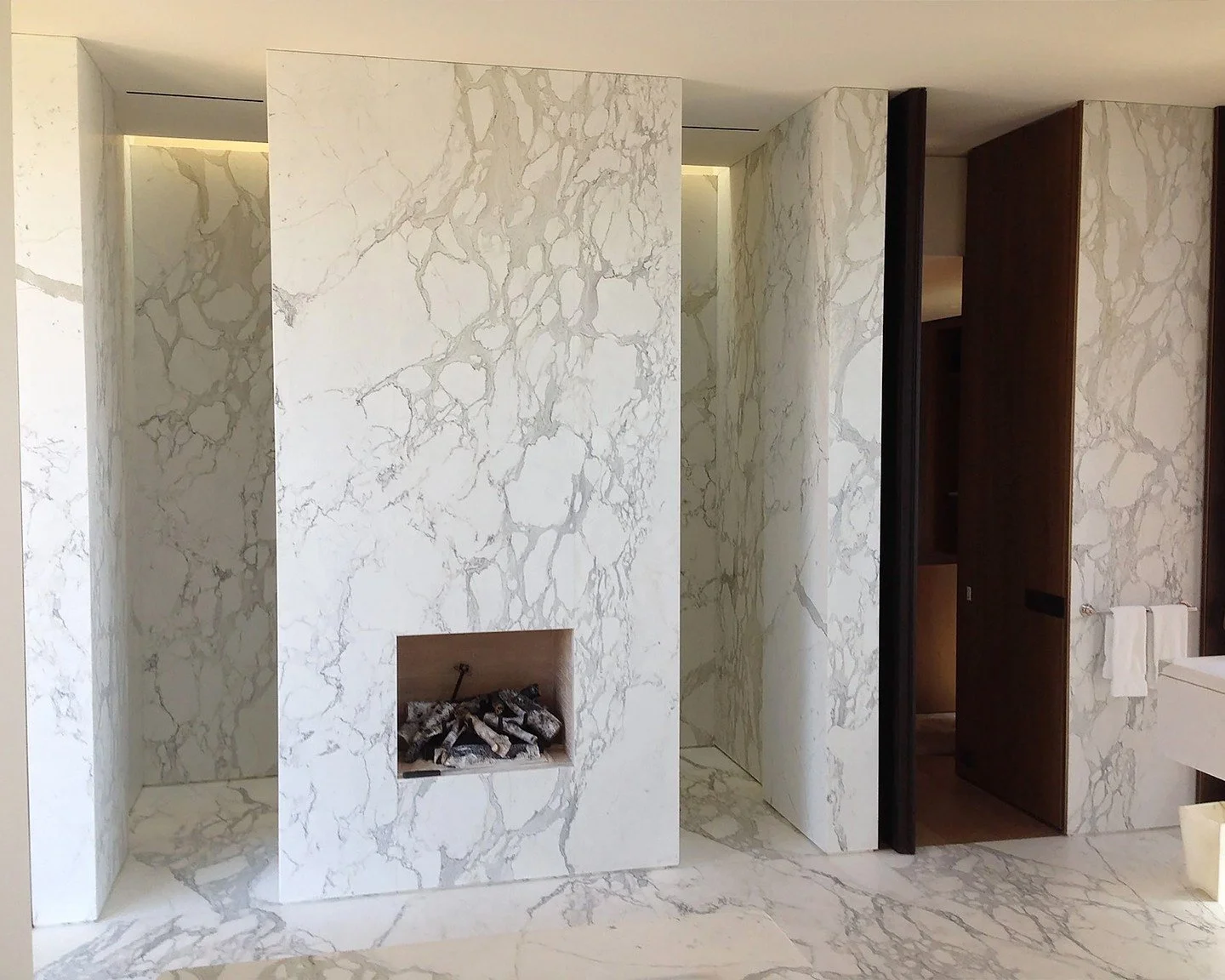 Completely Custom. Entirely Clad in Marble.
Every wall, floor, and detail of this bathroom was crafted from marble sourced and cut bespoke for this project. The result&mdash;an enveloping sense of calm and continuity where each vein flows seamlessly 