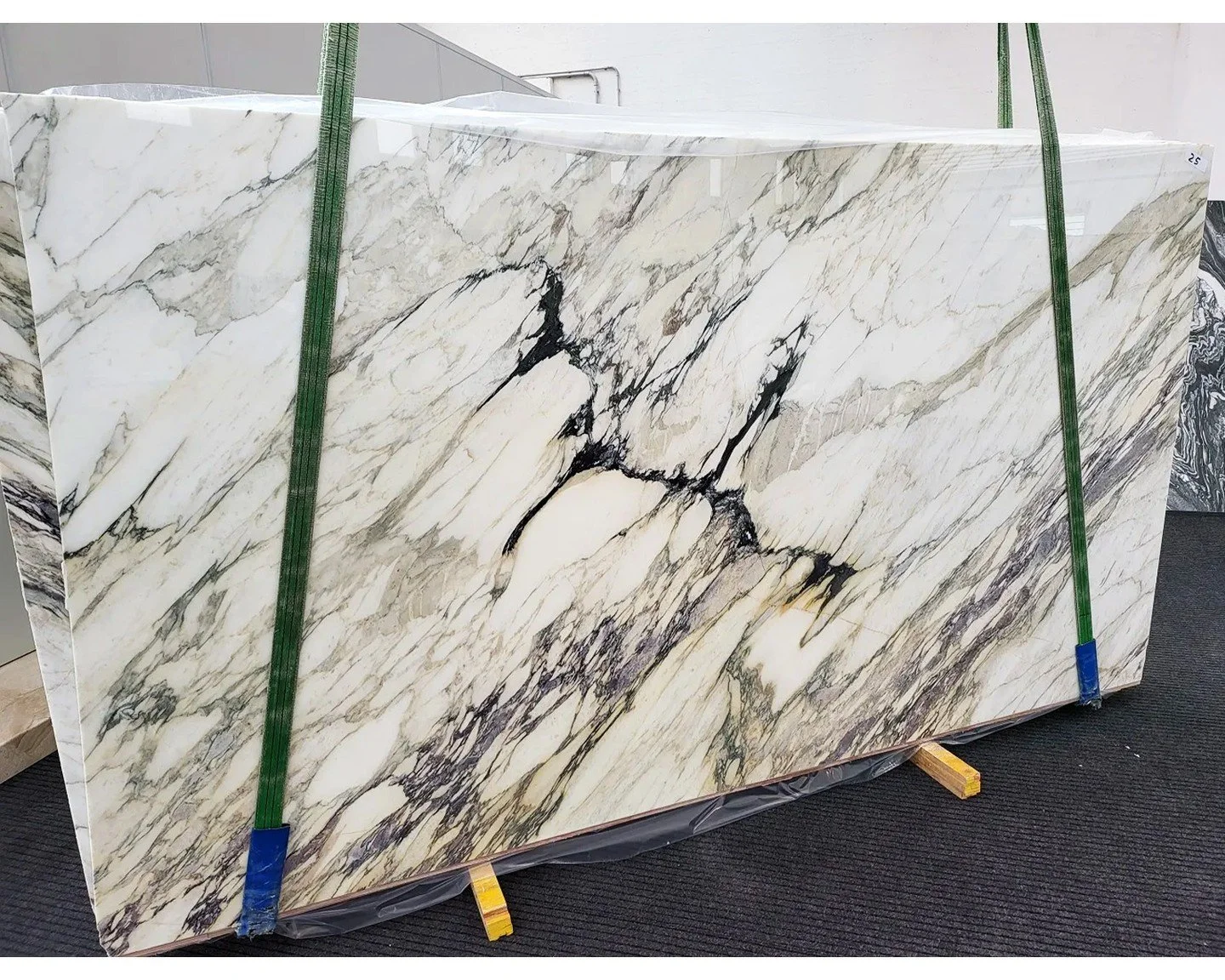 Calacatta Breccia
A dramatic, high-movement marble defined by bold black fissures, warm ivory fields, and expressive veining that feels almost sculptural in scale. This is the kind of stone that becomes the focal point of a room&mdash;an island, a va