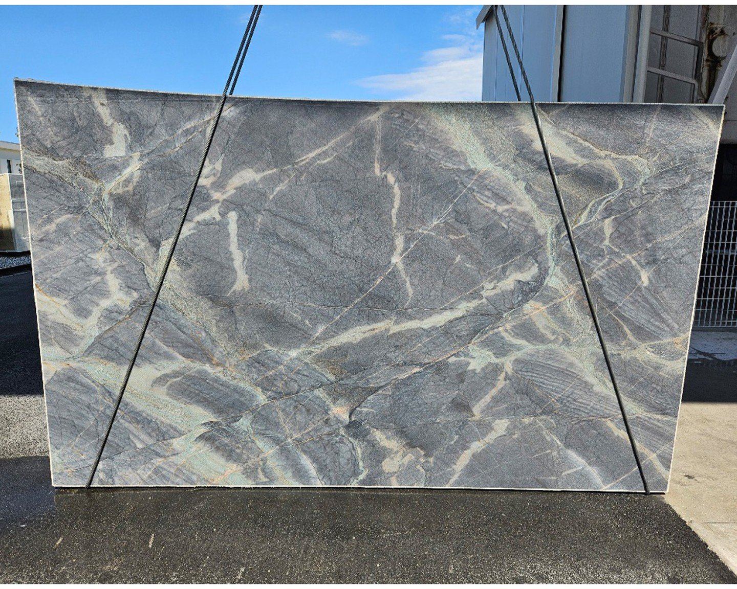 Zuma Quartzite, often referred to as Zuma Blue. An exotic natural stone defined by layered movement in blue, slate gray, soft violet, and subtle gold&mdash;its veining evokes the depth of ocean currents and the quiet drama of a twilight sky.

Beyond 