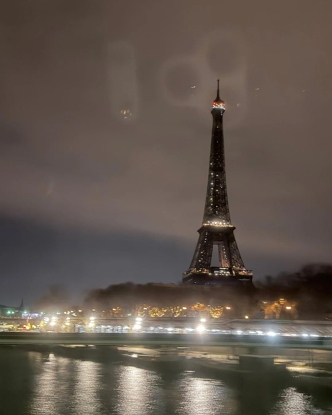 Between departures and arrivals, a quiet Paris moment.
Even in motion, there&rsquo;s always time to pause&mdash;watching the city glow, the river reflect, and the familiar silhouette remind me why this place never loses its pull.
