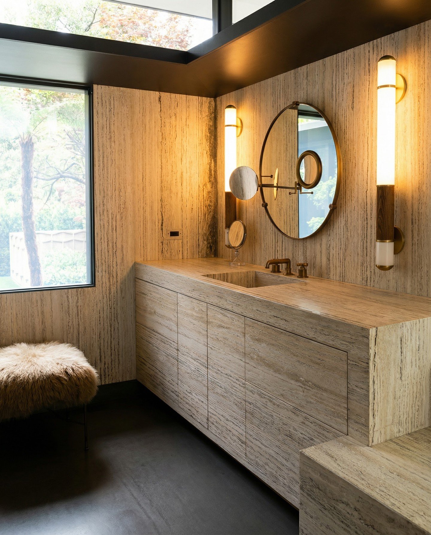 Fully clad in vein-cut travertine &mdash; walls, vanity, and an integrated stone sink &mdash; this West Hollywood primary bath is pure material immersion. Every surface was hand-selected and fabricated to read as one continuous, sculptural moment.
Th