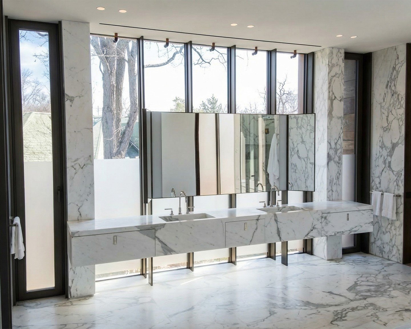 The view outside is beautiful. The view inside might be better. Full Calacatta marble &mdash; walls, floors, and a custom fabricated double vanity &mdash; for a Canada residence spa bathroom.
This is what we do.