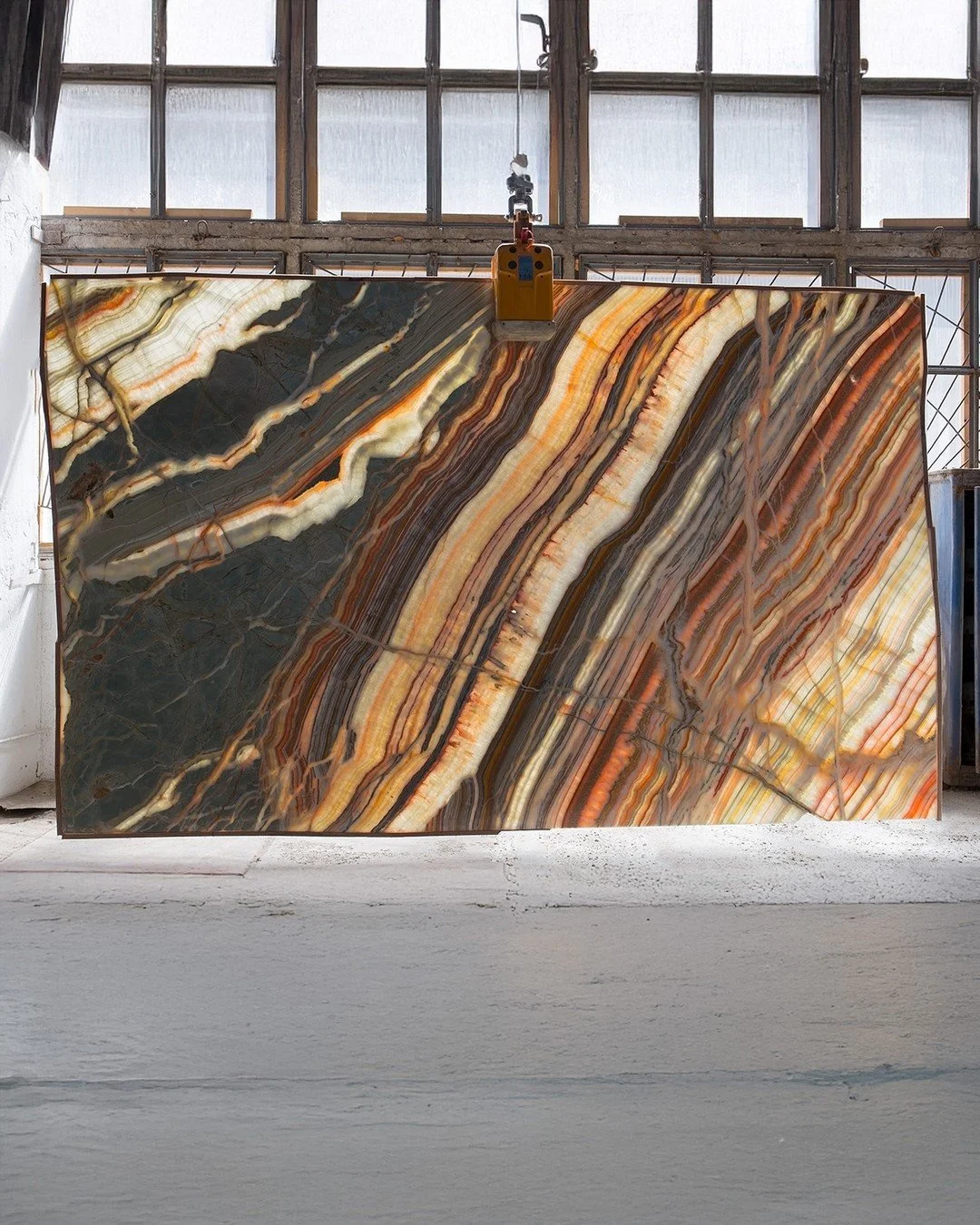 The translucent nature of onyx is perfect for backlighting.  Installing LED fixtures with color changing capabilities can create incredible scenes that change at the touch of a button.  This image shows the warm glow of a sheet of onyx from a simple 