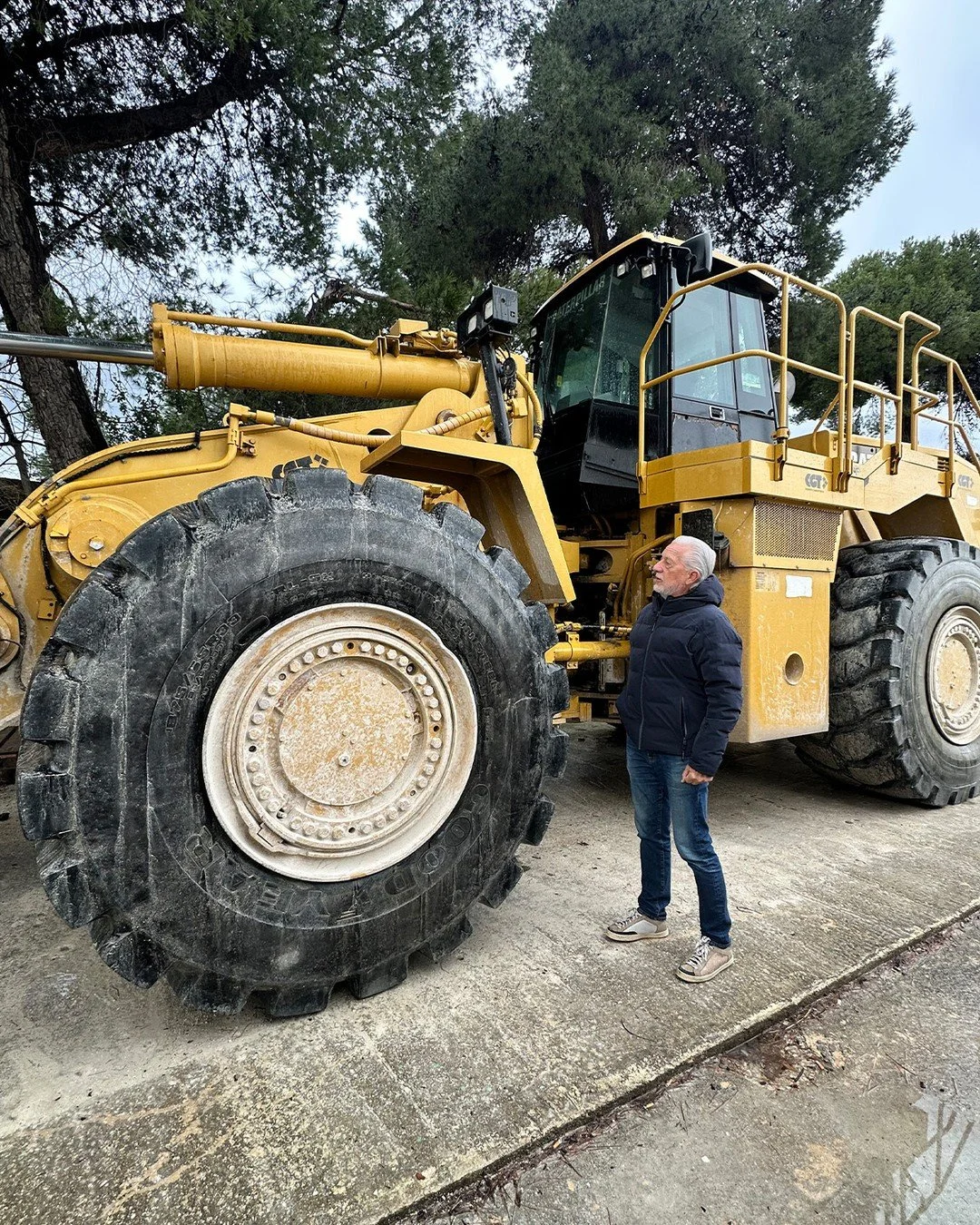 That is Sandro standing next to that tire. 
Massive machines worth millions of dollars are required to move the marble around from mountain to stone yard. The journey to your design project is longer and more remarkable than most people realize.
We'v