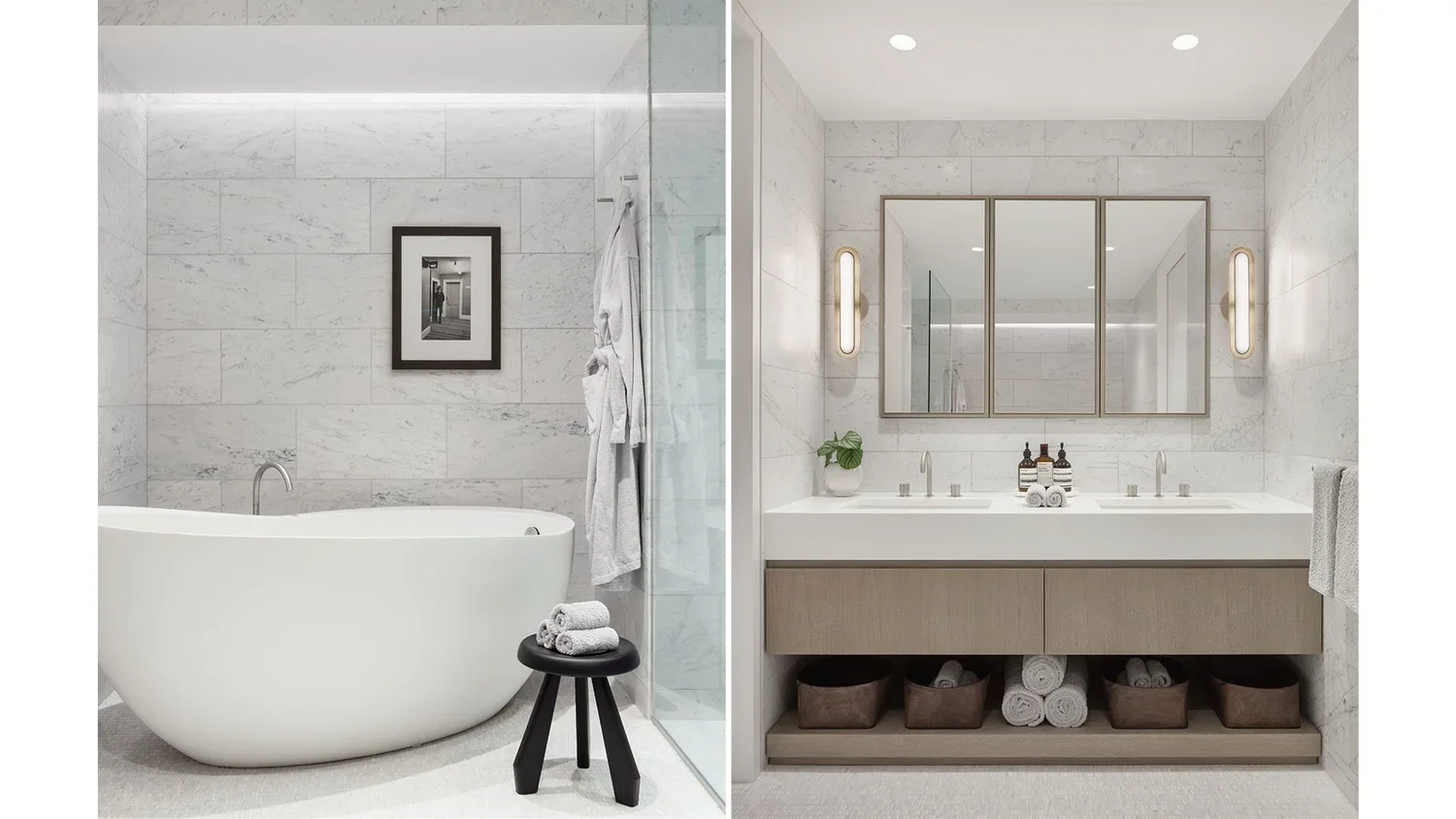 Side-by-side view of two modern bathrooms with white marble walls. The left bathroom features a freestanding bathtub, a small black stool with rolled towels, and a picture on the wall. The right bathroom has a double sink vanity with a large mirror, 